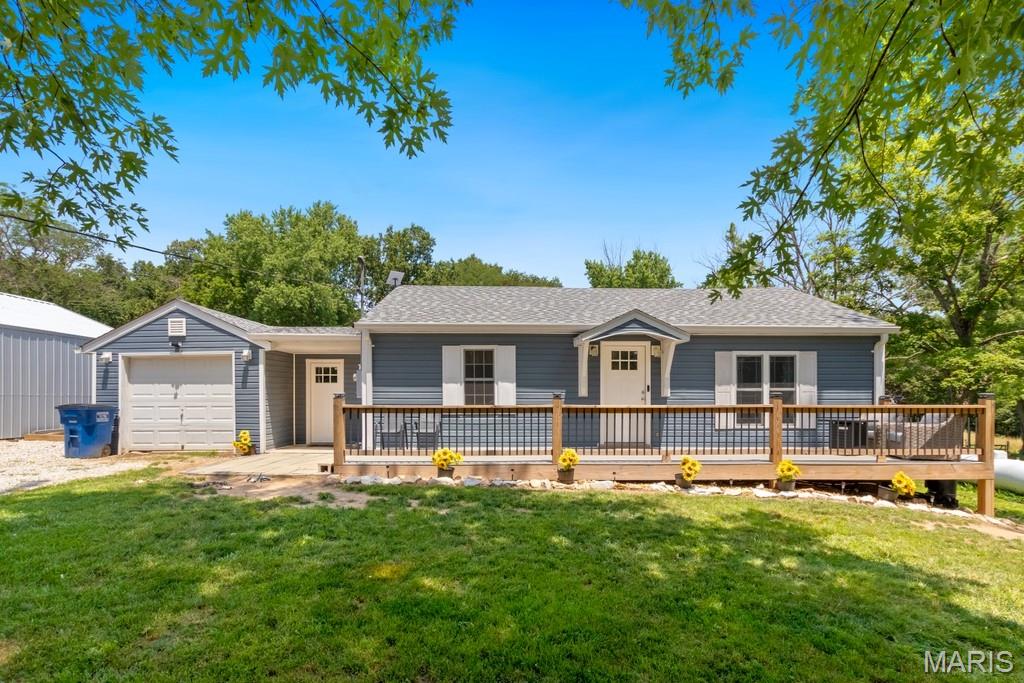Welcome to your dream mini farm! Nestled on a beautiful, fully fenced property with a peaceful creek running along the boundary, this completely renovated 2-bedroom, 2-bathroom home is ready for its next owner.

Taken down to the studs and thoughtfully rebuilt, the home features an easy floor plan, solid surface countertops, and a cozy pellet stove that provides efficient, economical heat throughout the winter months. Major updates during ownership include the roof, siding, HVAC system, water heater, septic, and much more, giving you peace of mind for years to come.

Step outside onto the new composite deck and enjoy the picturesque views of your hobby farm. The property is fully equipped with a 25x33 outbuilding, multiple fenced pens for goats, chickens, pigs, or other small livestock, and a spacious fenced pasture perfect for horses, cattle, or whatever animals you've dreamed of raising. Bordering the property, you will find a nice creek to cool off in the summer months. 

Whether you're looking to start a homestead, enjoy country living, or simply own a move-in-ready home with room to roam, this one checks all the boxes. Modern updates, functional farm amenities, and the charm of a creekside setting make this a rare opportunity you won't want to miss.