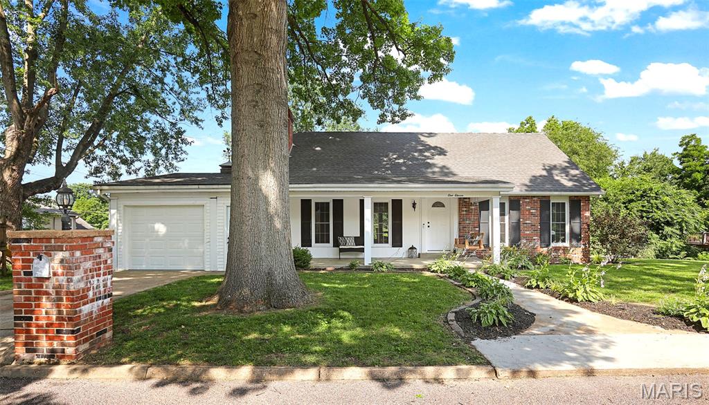 Discover your next chapter at 111 Holman ST, WASHINGTON MO 63090, a charming single-family residence built in 1940 that stands as an inviting home, ready for you to move in and begin creating new memories. It offers a wonderful living room featuring wood floors and stained glass windows and built-in bookcases flanking the fireplace. Also, well appointed with neutral paint, moldings and flooring throughout, a main floor laundry, and a finished walk-out lower level. This property offers a unique opportunity to embrace comfortable living in a desirable location. With three well-proportioned bedrooms, this home provides ample personal space for everyone. The two bathrooms ensure convenience and comfort for daily routines. The classic ranch architectural style contributes to a welcoming curb appeal. Practicality is enhanced by an attached garage, offering secure parking, plus additional off street parking and an outbuilding. A welcoming porch provides an ideal spot for relaxation and enjoying the outdoors. To truly appreciate the thoughtful design and comfortable living offered by this property, schedule your private viewing today.