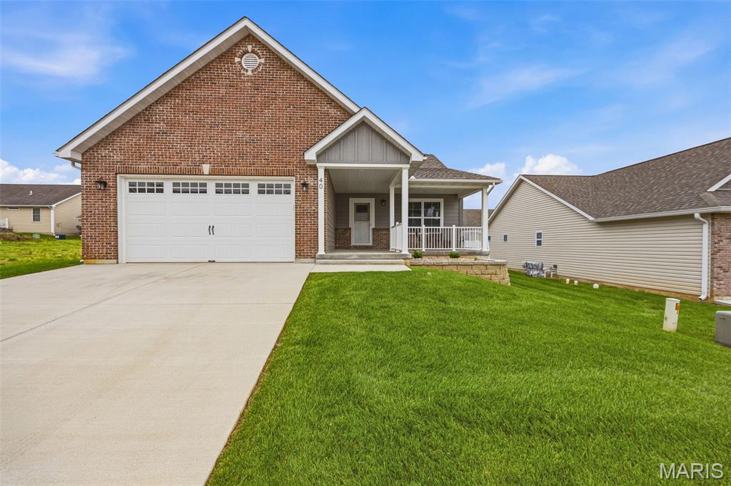 Beautiful like-new 2-bedroom, 2 bath villa located in the highly sought-after Butterfield Gardens! Enjoy low-maintenance living in this gated 55+ community featuring a clubhouse, inground pool, and scenic walking trails. This open floor plan is perfect for entertaining with a spacious chef's kitchen offering custom cabinets, hard surface counter tops, large island, stainless appliances, and coffee bar area. Main floor laundry adds convenience complete with washer & dryer. The full unfinished basement with egress windows offers endless possibilities for additional living space. Complete with a 2-car attached garage, this villa combines comfort style, and easy living all in one!