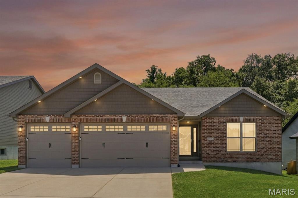 Welcome home to this beautifully updated 3-bedroom, 2-bath brick-front ranch where modern finishes, thoughtful upgrades, and a peaceful setting come together. Filled with natural light from the impressive 12-foot French sliding door, the open floor plan features luxury vinyl plank flooring throughout, updated light fixtures, a spacious great room with a cathedral ceiling, and main-floor laundry for everyday convenience. The stunning kitchen is designed to impress with granite countertops, 42-inch custom cabinets that extend to the ceiling, built-in LED cabinet lighting with adjustable colors, a large pantry, and an open layout that's perfect for gathering with family and friends. Retreat to the primary suite featuring a beautiful bay window, then step outside to the covered deck with a ceiling fan overlooking a private, low-maintenance backyard that backs to mature trees, where deer are frequent visitors and the setting feels peaceful year-round. Additional highlights include a 3-car garage, in-ground sprinkler system, newer roof, gutters, and quality finishes throughout. Located in a highly desirable neighborhood, you'll enjoy exceptional amenities including a community pool, clubhouse, playground, and a basketball court, along with nearby walking trails and fishing. This home offers the perfect balance of comfort, convenience, and outdoor recreation.