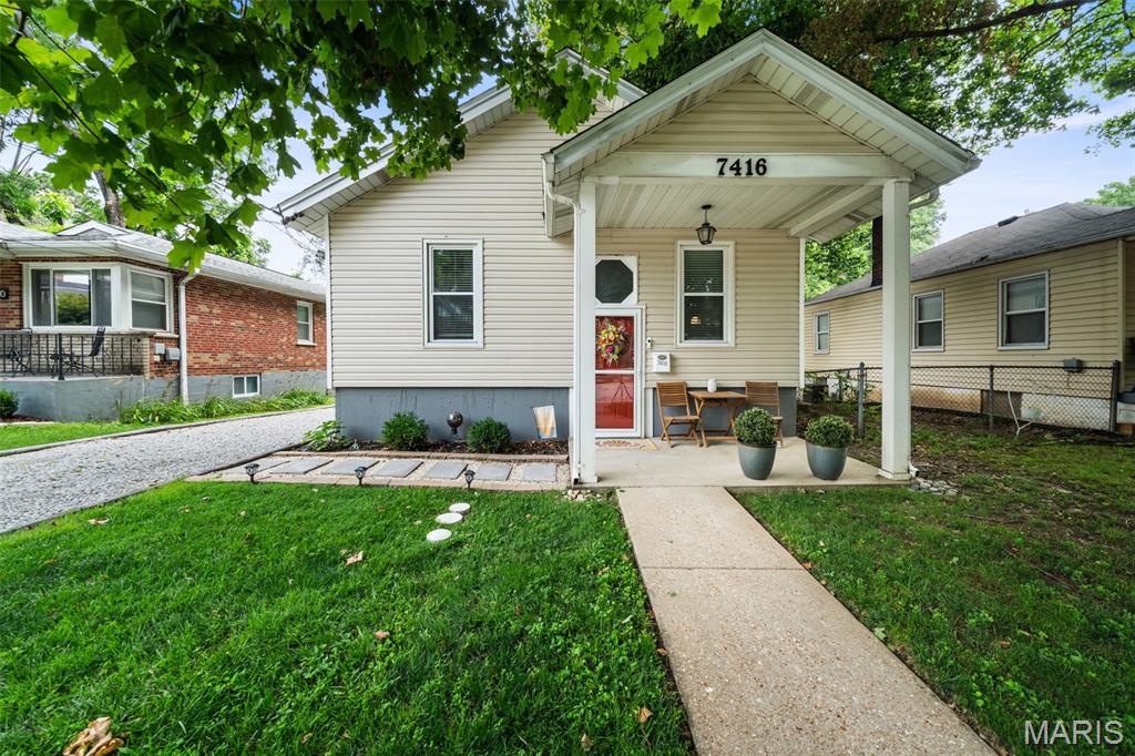 Charming and well-maintained, this 2-bedroom, 2-bath home offers just under 1,500 square feet of comfortable living space in a convenient location. Bright, open common areas feature engineered wood flooring, while both bedrooms and the partially finished lower-level offer carpeting. The inviting kitchen is highlighted by a vaulted ceiling, newer cabinetry, granite countertops, and sleek black appliances. Both bedrooms are thoughtfully positioned on the upper level with separation for added privacy. The spacious primary bedroom provides room for a reading or sitting area, direct access to the shared bathroom, and a large closet. The lower level offers ample space for recreation, a home office, or a fitness area. Two additional unfinished rooms provide practical storage, including a dedicated laundry room and a utility/storage room with direct backyard access. Exterior highlights include a driveway with space for three + vehicles, a backyard that is perfect for entertaining with a shed and privacy fence. Roof installed in 2025, and vinyl siding installed in 2026.