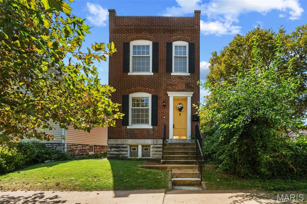 Forget the yellow brick road... we’re following the yellow front door straight to 4066 Phillips ;) Built in 1903... but thankfully, most of the 1903 stayed on the outside! This 2 bed, 2 bath Tower Grove South cutie serves up all the century-home charm with a hip, contemporary interior + a floor plan that just works, and works well. Start with the happiest yellow front door on the block, then step inside to refreshed hardwood floors, soaring ceilings + an original wood mantel with decorative tile that’s been looking good for 123 years. The open floor plan flows from the living room into the dining room, past a convenient powder bath + into the refreshed kitchen with white cabinetry, granite countertops, SS appliances and a gray tile backsplash. And those extra-tall ceilings throughout? Before A/C, they weren’t just showing off... our 1903 friends knew a thing or two about staying cool. Upstairs, an open-riser staircase leads to a dramatic two-story foyer + upper-level overlook that keeps things feeling anything but century-old. Both bedrooms offer beautiful flooring, generous closets + updated fixtures, while the primary adds walkout access through an original door topped with a stained glass transom. The full bath keeps things decidedly this century with a shower/tub combo, modern vanity + updated lighting. Downstairs, the partially finished basement adds wood-look flooring, exposed stone walls + room for an office, gym, rec space or whatever else you’ve got cookin’. There’s even enough old-world stone down here to make us wonder where they hid the beer barrels. Out back, TWO decks are practically begging for a little St. Louis-style Mardi Gras action. Beads optional, good times encouraged. Add a fully fenced yard, 2-car off-street parking opporunity + a location just blocks from Tower Grove Park, neighborhood cafes, restaurants and STL staples. 123 years old and still knows how to have a good time. CHEERS!
