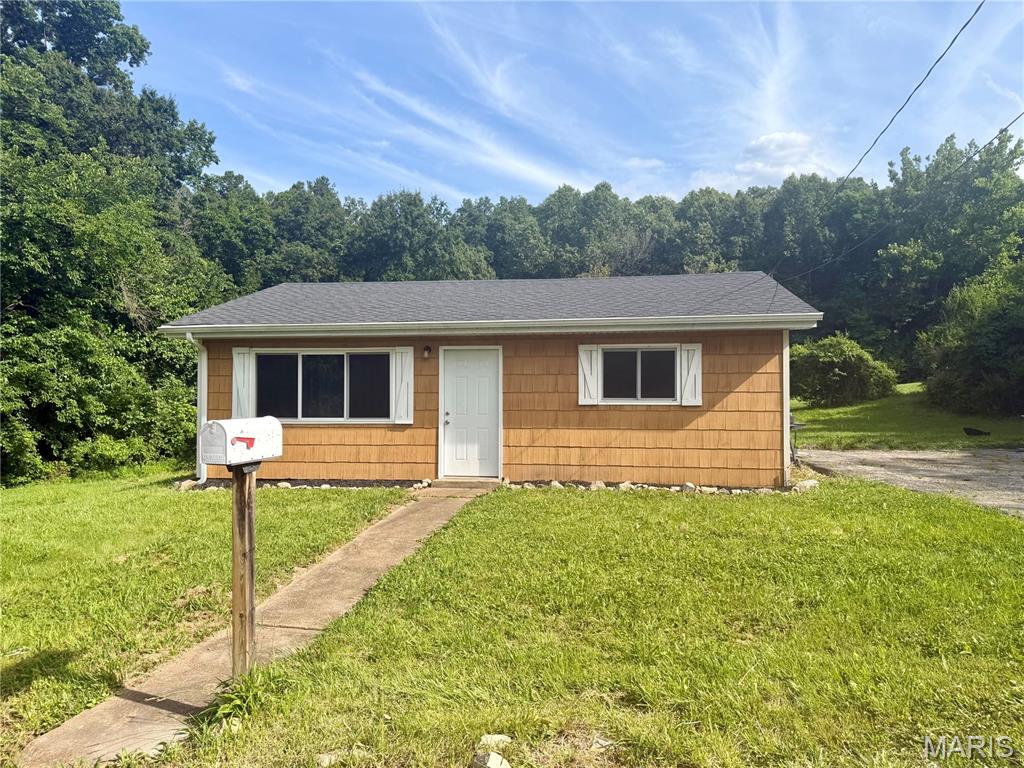 Welcome to this beautiful home on a secluded street right in the heart of House Springs! You don't want to miss this gem. It is completely renovated and turn key ready to make your own. This home boasts 2 bedrooms and 1 bathroom. There is a gorgeous backyard view of privately owned woods and vacant lots adjacent, making it the perfect, private, country oasis. This home is also conveniently located to several amenities including, shopping, restaurants, and public parks. It is a 15 minute drive to Gravois Bluffs and to top it off, Big River is a stone's throw away from the front door. Call me if you'd like to see it! You're guaranteed to fall in love!