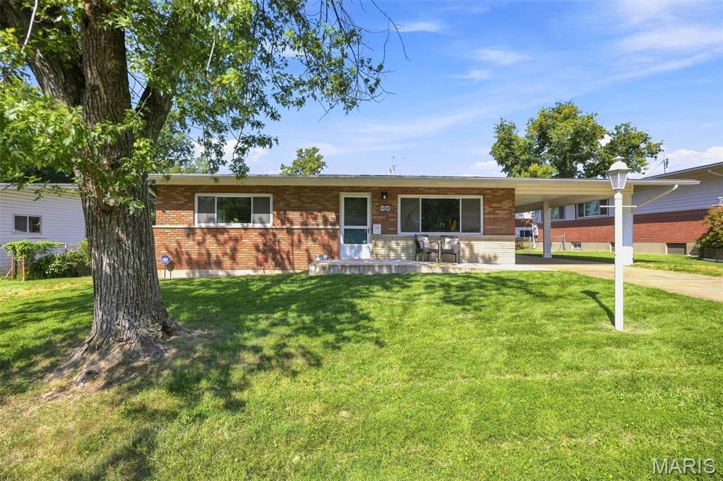 Mid-century modern style meets fresh, move-in-ready updates in this spacious 2-bedroom home with 1 full bath and 2 half baths. With 1,247 square feet on the main level plus approximately 455 additional finished square feet in the basement, this home offers far more space than you might expect. Beautiful hardwood floors run through the living room, dining room and generously sized bedrooms, while updated LVT in the kitchen- the true heart of the home.... and LVP in the finished basement add both style and durability. The open, airy layout is complemented by fresh paint, all-new lighting, updated vanities, sinks and faucets throughout.  There is also main floor laundry as well as hook-ups in the basement, so you choose....main floor laundry or mega pantry?  Downstairs, the finished lower level offers even more room to spread out, along with the convenience of one of the home's two half baths. Outside, you'll find a large, level, fully fenced backyard with plenty of room for dogs to run, friends and family to gather, garden beds to grow and backyard cocktails to be enjoyed. Out front, the bold front door adds the perfect pop of personality and curb appeal. Stylish, bright and thoughtfully refreshed from top to bottom, this home blends classic character with modern finishes in all the right ways.