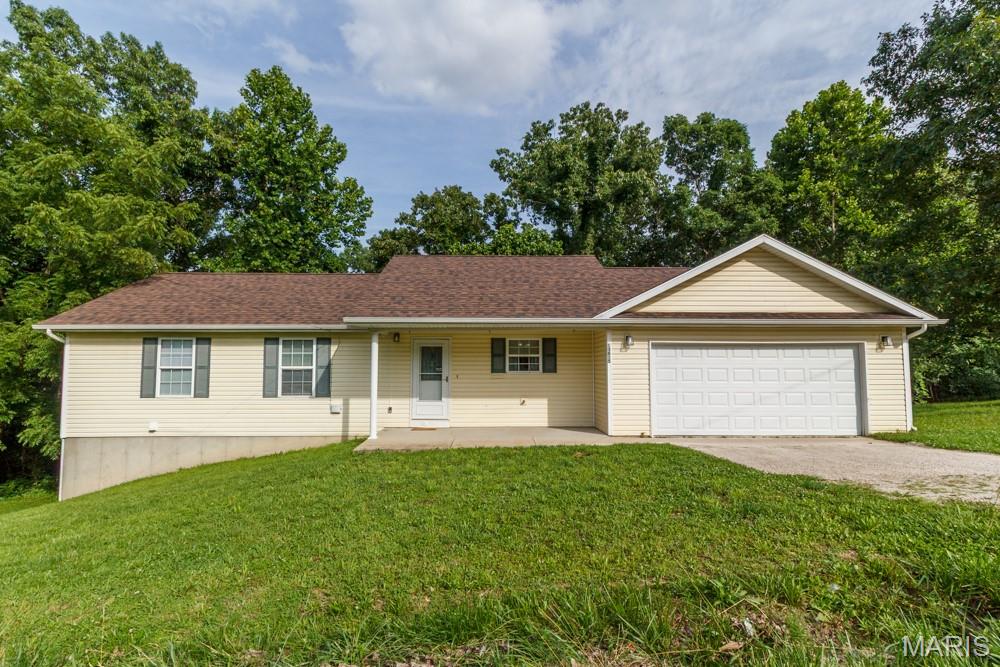 What a charming three-bedroom, three bath home in a nice quiet subdivision.  If you want a country feel but close to all of St. Robert's amenities, this is the home for you.  Many modern updates throughout! The living area features a fireplace with an open floor plan adjoining the beautifully updated kitchen.  The primary bedroom suite and an additional bedroom round out the main floor.   Downstairs is a partially finished basement to include a third bedroom with full bath and a nice living area for plenty of space and privacy.  This home has so much to offer! Reach out to schedule an appointment before this one gets away!
