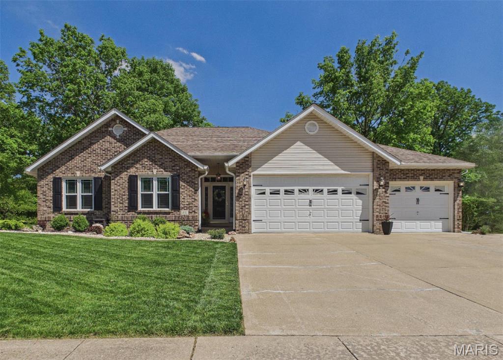 Immaculate, well cared for home in a desirable Edwardsville Subdivision close to all the amenities! The main level features a welcoming entry foyer, formal Dining Room, Exquisite Kitchen w/solid surface counters, Stainless Steel Appliances, new tile backsplash, Breakfast area that leads to the low maintenance composite deck that overlooks the wooded backyard.  Down the hall is a convenient drop-off zone, Laundry room with cabinets & deep sink. The Great Room has a vaulted Ceiling & Gas Fireplace. Primary Bedroom has a walk-in closet, Bathroom w/double vanity, newer walk-in shower and linen closet. Bedroom 2 & 3 and a full bath complete the first floor.  The Walk-out Lower Level features a Family Room, Exercise Room, Full Bathroom, Bonus Room w/large walk-in closet, Storage Room and a nice Work Room. The walk-out leads to a spacious patio for your summer enjoyment. The home has a 3 car attached garage and a newly landscaped yard! See list of highlights for all of the updates!