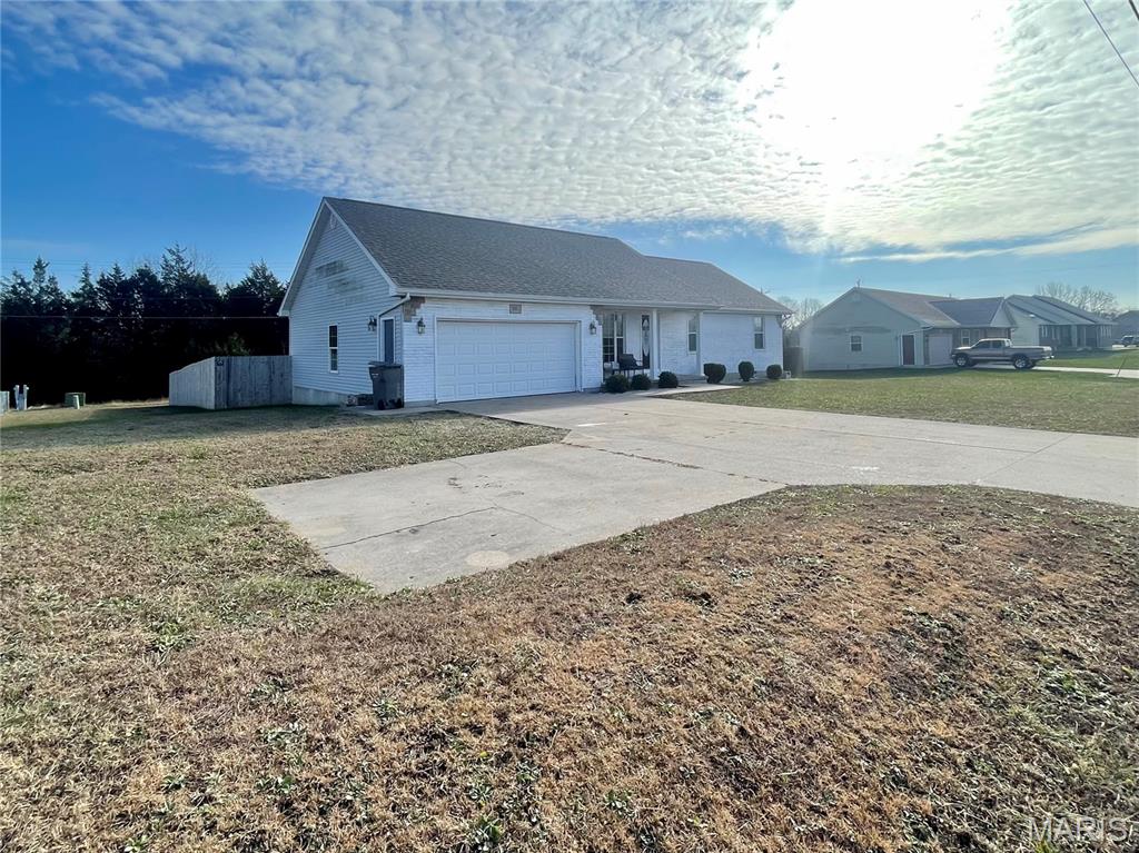 Beautifully Maintained 3 Bedroom, 2 Bathroom Residence in St. Robert, Missouri! This attractive home features an inviting covered front porch and a spacious open layout designed for comfortable everyday living. The kitchen is equipped with modern stainless steel appliances, providing both style and functionality. Just off the dining area, you’ll find a back deck that offers an ideal space for outdoor entertaining. The privacy-fenced backyard is perfect for pets, gatherings, or simply enjoying a quiet moment outdoors. The primary bedroom includes two closets and a private bathroom, while two additional bedrooms and a full bathroom complete the interior living space. A two-car garage provides excellent storage and convenience. Located near Fort Leonard Wood, as well as local shopping and dining, this home offers exceptional value in a sought-after neighborhood. Don’t miss the opportunity to make it yours!