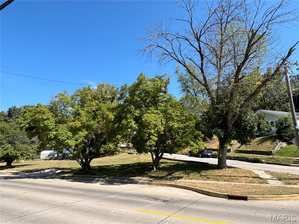 Zoned C-Commercial - 408 Grand Avenue – Opportunity awaits with this 0.208-acre vacant lot, once the site of a comfortable size home with 2 driveways and now cleared! Conveniently located on Grand Avenue, this property offers a blank slate to build your vision—whether a new home, investment property, or other possibilities. A great chance to secure land in town with easy access to local amenities. Utilities available. You will not find another lot at this price and in this convenient location!