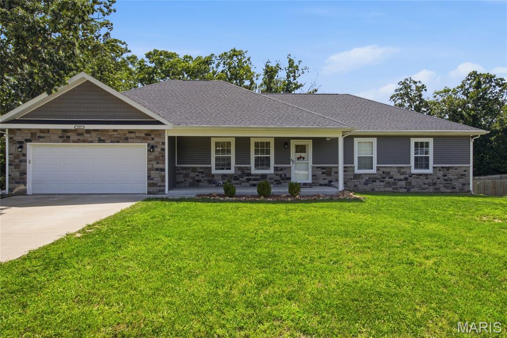 This beautiful 4-bedroom, 3-full-bath home offers the rare opportunity to own a 3 year old home on 7.83 acres of unrestricted land- AND STILL be close to town and Fort Leonard. Since it is such a newer home buyers can spend less time worrying about the high ticket items such as the roof, HVAC system, appliances, and other major features, and more time to enjoy the home and property and less reason to expect costly replacements right away.

The thoughtfully designed main level features an open kitchen, dining and living area filled with natural light. From the dining area, step directly onto the covered back deck overlooking your own wooded acreage—with no neighbors directly behind you, just land, trees, and plenty of deer wandering throughout.

The large primary bedroom offers plenty of space and includes a private bathroom with a double vanity, and a large walk-in closet. Two additional bedrooms and another full bathroom complete the main level.

The walk-out basement adds a large recreation area, fourth bedroom, full bathroom, laundry area and bonus room. It also includes a separate John Deere garage, perfect for the mower, ATV, tools, or use as extra storage!

The sellers have created their own little camping spots throughout the property and enjoy exploring the woods. 

 Enjoy the convenience of  living  close to town, while still having nearly 8 unrestricted acres, no neighbors directly behind you and a beautiful newer home—all at a reasonable price. Buyers searching in the St. Robert–Waynesville area know this combination does not come along often. Come take a look and share your thoughts!