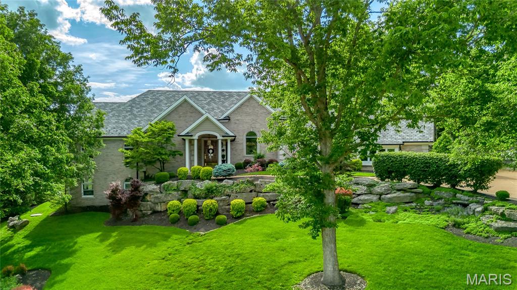 Sensational full brick great room ranch on St. Albans Country Club grounds. This custom-built home features 5800 sf of living space enhanced by soaring ceilings, oak hardwoods, detailed trim work & expansive windows with perfect views of the 17th fairway on Lewis & Clark Golf Course. Dramatic barrel-vaulted porch entrance leads to impressive foyer, coffered dining room framed by architectural pillars, private study and striking great room with box beam ceiling. Designer kitchen with 42” glass-front white cabinetry, granite countertops, premium appliances & 15‘ breakfast bar adjoins breakfast room with marble fireplace & convenient planning center & light-filled sunroom. Spacious primary bedroom suite with wide bay window & luxury bath with shower spa offers an appealing retreat. Hardwood floors continue to the Lower Level with recreation room with wet bar & game room plus 3 additional bedrooms & 2 full baths. Situated on a 1+ acre lot with covered deck & patio surrounded by landscaped gardens.