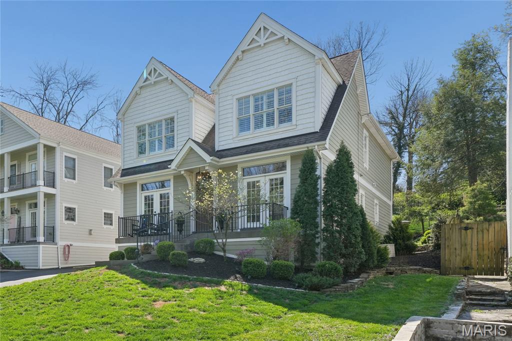 Newer four-bedroom, four-and-a-half-bath two-story residence offering approximately 4,400 square feet of finished living space across three levels, in move-in condition in the heart of Ladue. The home features a renovated kitchen and baths, an open floor plan with luxury finishes, light-filled southern exposure, and room to add an elevator. The gourmet center-island kitchen includes quartz countertops, white cabinetry, stainless steel appliances, and a butler’s pantry.  Amenities include hardwood floors, crown moldings, plantation shutters, two gas fireplaces, walk-in closets, and a cubby area. The upper level offers four bedrooms, three baths, and a second-floor laundry, including a spacious primary suite with a large walk-in closet, jetted tub, and separate shower. The lower level includes a recreation room, playroom, full bath, and generous unfinished storage. Ideally situated on a quiet, tree-lined street across from John Burroughs School, within the Ladue School District (Reed Elementary), and close to private schools, highways, the airport, shopping, dining, and the Clayton business district. Includes a Home Protection Plan for the buyer. Notice the wonderful short walking path to Community School next door. Beautifully landscaped plus has invisible fence for your dog. Why wait to custom build- compares to a new custom home. Seller prefers a July-2026 closing. Welcome!