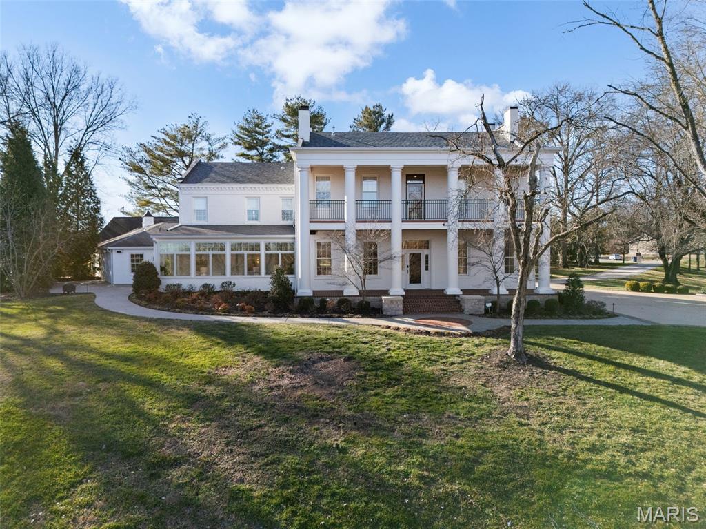 Step into a truly top-notch Southern-inspired grand columned facade home that blends classic charm with modern luxury.