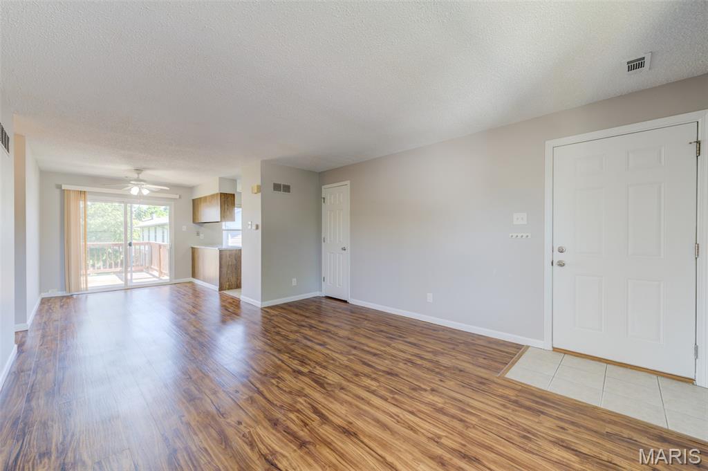 Move right in and enjoy affordable, low-maintenance living in the heart of St. Peters! With a LOW PRICE and LOW MONTHLY HOA FEE, this well-priced condo is the perfect opportunity to own for less than rent.  Inside, you’ll find stylish LVP and ceramic tile flooring throughout, insulated vinyl windows, six-panel doors, and fresh neutral greige paint that creates a warm, modern feel.  The spacious primary bedroom features a double closet, while the second bedroom offers a walk-in closet for extra storage. Recent updates include a newer 10x7 deck, newer electric furnace, and newer air conditioner for added comfort and peace of mind.  The common basement includes a secure private storage area with washer/dryer hookups, and the seller is willing to include the washer, dryer, and kitchen refrigerator with the sale.  Enjoy all the benefits of carefree condo living while the association takes care of exterior maintenance, lawn care, common areas, pool, playground, basketball court, and trails.  The HOA fees include the trash service, and roof replacement is planned and paid for - so that should not be a worry for some time.  Conveniently located in the center of St. Peters with quick access to parks(right across the street!), hiking and biking trails, shopping, restaurants, and major highways, this home truly combines value, comfort, and convenience. Don’t miss your chance to own this hidden gem — schedule your showing today!