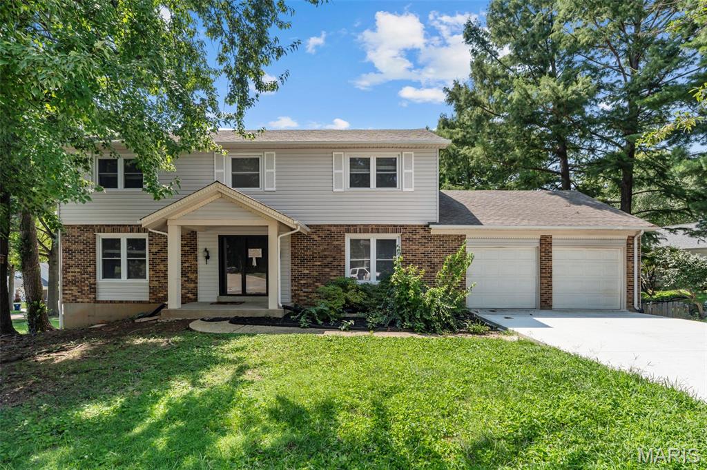 Welcome to this beautifully renovated 2-story in Parkway Schools! Situated on a quiet, tree-lined street, this home is just steps from Craig Elementary and moments from highways, restaurants, Westport, shopping along Olive and Page. Brick accents, a covered front porch, and double doors lead you inside. The foyer opens to the bright living room to the left and dining room to the right, featuring a chair rail and stylish lighting. The living room is open to the family room, with luxury vinyl plank flooring running throughout the main level, creating a cohesive look to the decor. The family room features a woodburning fireplace with wall-to-wall brick surround. The new kitchen has a breakfast room w/bar seating area, quartz countertops, stainless steel appliances, and a glass tile backsplash. A laundry area and half bath w/wainscoting and crown molding completes the main level. Upstairs, the primary bedroom has a spacious walk-in closet, and updated bathroom with gorgeous tile-surround step-in shower, modern light fixtures, and a new vanity. Three more bedrooms and a hall bath w/tile-surround tub completes the space. A walk-out, unfinished basement provides storage space. A new HVAC provides peace of mind. Enjoy summer on the large deck overlooking the patio and backyard. In a great central location and filled with updates, this home is one you won’t want to miss!