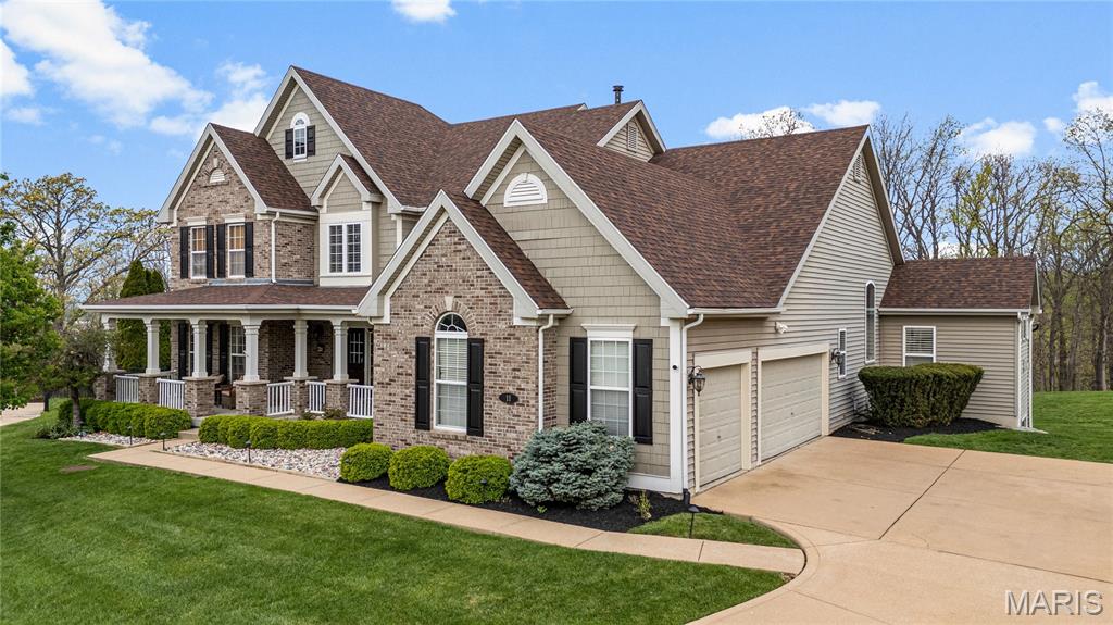 Nestled on a quiet cul-de-sac in the sought-after Tapawingo community, this stunning 1.5-story home offers an exceptional blend of elegance, comfort, and breathtaking surroundings. Set on over an acre along the fifth hole of Tapawingo Golf Club—a course designed by World Golf Hall of Famer Gary Player—the property enjoys a picturesque backdrop of rolling greens and mature trees.
A timeless brick facade, shake siding, and a welcoming front porch create striking curb appeal and a true sense of arrival. Inside, the beautifully updated foyer sets the tone, opening to a thoughtfully designed layout with a formal dining room, private office, and an expansive great room. The main-floor primary suite offers a peaceful retreat with fresh carpeting and custom California Closets. The soaring two-story great room features a wall of windows and a fireplace, seamlessly connecting to the gourmet kitchen and hearth room—perfect for both everyday living and entertaining. The kitchen is appointed with granite countertops, a large center island, built-in refrigerator, and a premium Wolf range, sure to delight any home chef. A stunning four-season room extends the living space and provides year-round enjoyment of the serene backyard and golf course views.
The finished walk-out lower level is designed for entertaining, complete with a bar, wine cellar, spacious recreation areas, a fifth bedroom, and full bath. Step outside to a newer patio, where a private fire pit invites relaxing evenings under the stars.
Upstairs, you’ll find generously sized bedrooms, including a Jack-and-Jill bath and an en-suite guest room, offering comfort and flexibility for family and visitors alike. With over 6,000 square feet of living space, updated lighting, rich hardwood flooring, and an oversized three-car garage, this home delivers luxury, space, and an ideal setting for both everyday living and unforgettable gatherings. New flooring in foyer, four season room added (2022), new roof (2025), new front landscaping (2025) and new carpet in primary suite and office (2026).