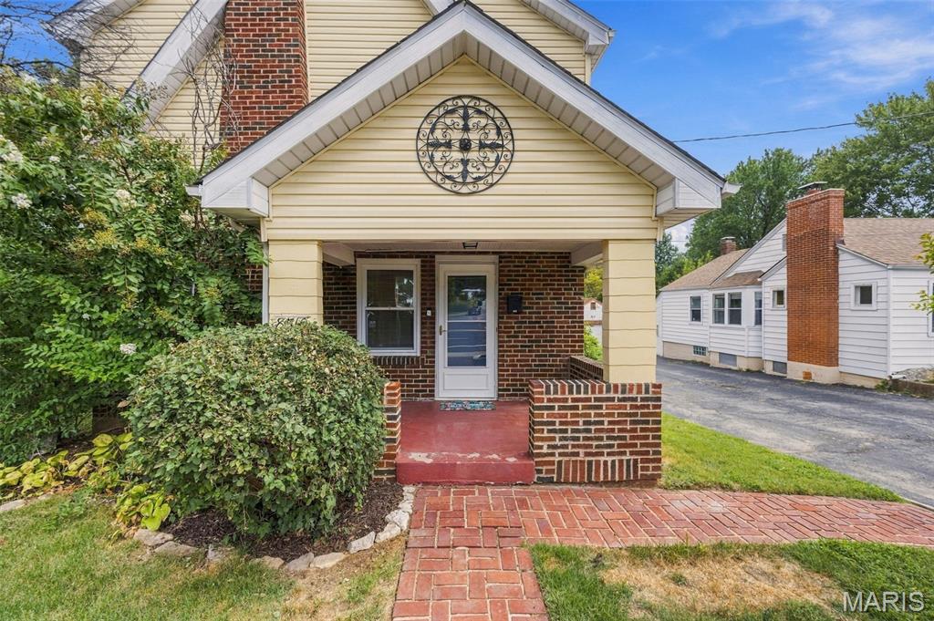 Some homes simply have a story to tell and this one has character around every corner! Step inside this charming 3 bedroom, 2bath home and discover nearly 2,000 finished square feet filled with timeless architectural details, including beautiful hardwood floors, arched openings, stained glass accents and a classic brick fireplace anchoring the spacious living room. The main level offers plenty of room to spread out, including a spacious main-floor primary bedroom, while the kitchen adds a fun pop of personality with painted cabinetry, stainless steel appliances and generous workspace. Upstairs, you'll find additional bedroom space and a full bath. Downstairs adds even more versatility with additional living space currently used as a home gym, perfect for a rec room, workout space, hobby room or whatever fits your lifestyle. And just wait until you step outside! The backyard becomes your own private retreat featuring multi-level gathering spaces, above-ground pool, storage shed and a spacious fenced backyard with plenty of room to gather, play or simply unwind. Ideally located between the Gravois and Watson corridors, just minutes from Grant's Farm and convenient to shopping, dining and everyday essentials. Classic St. Louis charm, nearly 2,000 sq ft and a backyard made for enjoying, this treasure chest of charm is one you will be proud to call HOME!