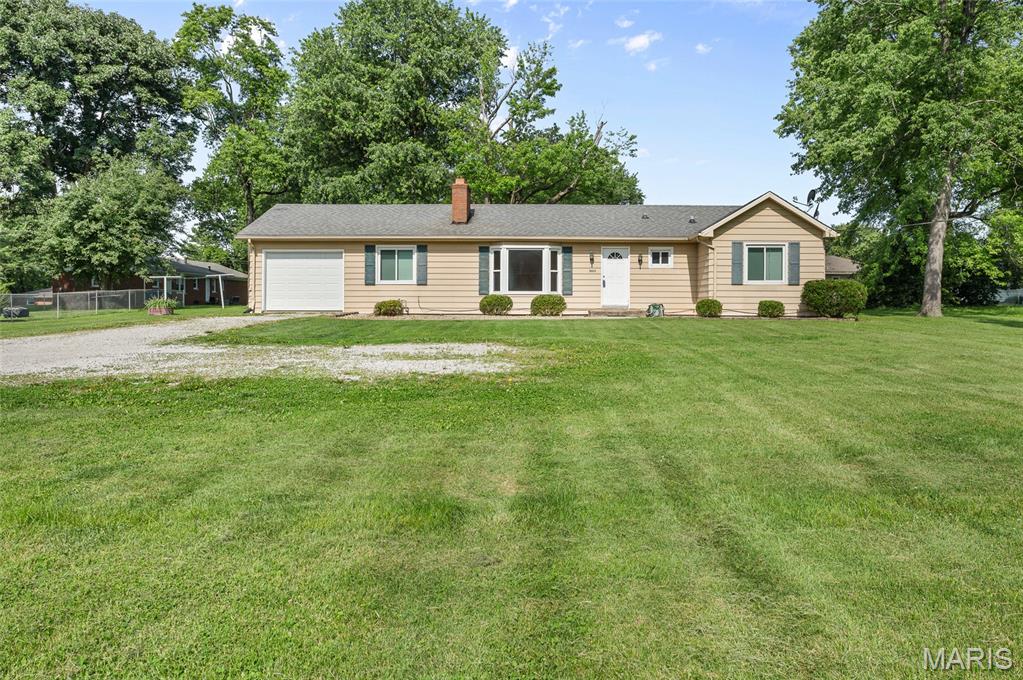 This Property is a great property to live in or have as an investment property. Less than 1 mile of Rt 159.  Convenient location. This 3 bedroom 2 bath with a basement. This home has had a kitchen update. It is move in ready. Home has a large backyard. 1 Car attached garage!