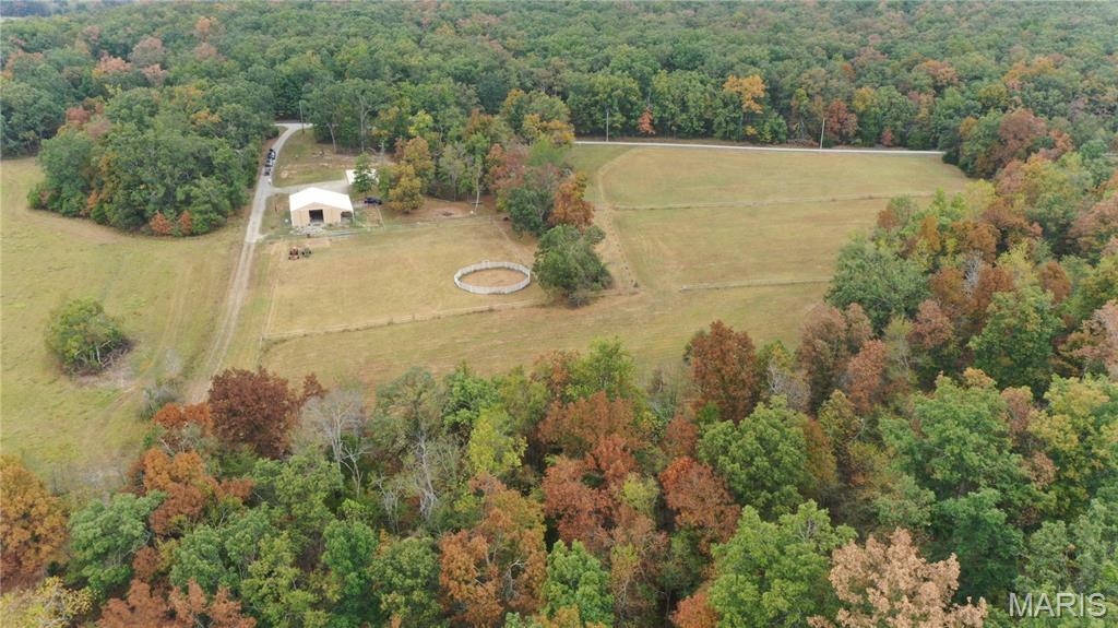 20-Acre Equestrian Homestead & Trail-Rider’s Paradise (No HOA)
Privacy. Freedom. God’s Country. Tucked away just a short, scenic drive off Highway T, this unrestricted 20-acre property offers the ultimate rural escape. Whether you are looking for a turn-key horse facility, a private hunting retreat, or a dual-income vacation property, this land is ready for your vision. Located just minutes from the Castor River Conservation Area and a stone's throw from Missouri’s premier trail-riding destinations (St. Francois, St. Joe, Elephant Rock, Taum Sauk, and Johnson’s Shut-ins), this is a rare find. The Barn is Fully insulated with massive 12’ bay doors (perfect for truck/trailer pull-in), dedicated equipment storage, a pedestrian door, and a 10’ lean-to with 3 classic Dutch doors. Flexible Stabling: Equipped with spacious 12x12 stalls that can be customized or easily reconfigured to fit your specific discipline. Pasture & Water: 8.5 acres of highly secure, electrified fencing already cross-fenced into 5 separate pastures. A deep well services 3 hydrants (including a frost-free hydrant between pastures 4 and 5). The tankless water heater servicing the barn quarters is perfectly positioned to be converted into a hot-water horse wash bay.
?? Three Versatile Living Options
 The Barn Apartment: Move right in or rent it out. Features a finished 240 sq ft insulated living space inside the barn with wood-lined walls, a family/sleeping room, a full bath, and a kitchen (refrigerator & dishwasher included). Heated and cooled for year-round comfort.
 Off-Grid Cabin: A charming one-room guest cabin with 2 sleeping lofts and independent solar power. Features an exterior water hydrant and a layout that allows for an easy, dedicated secondary driveway.
The Ultimate Head Start on Your Custom Home: Skip the construction delays. A 50’x26’ concrete slab is already cleared, graded, poured, and fully plumbed for a 3-bedroom home. The installed septic system and drain field are already rated and approved for a 3-4 bedroom residence.
Acreage Breakdown: A perfect mix of flat to rolling hills, a 2-acre dedicated hay pasture, and 10 acres of mature woods featuring a private dry creek and beach area.
Outdoorsman’s Dream: Located in a prime wildlife corridor known for Elk, Turkey, and Trophy Whitetail Bucks.
Financial Freedom: Enjoy exceptionally low rural property taxes, a formal road maintenance agreement in place, and absolutely no HOA restrictions.