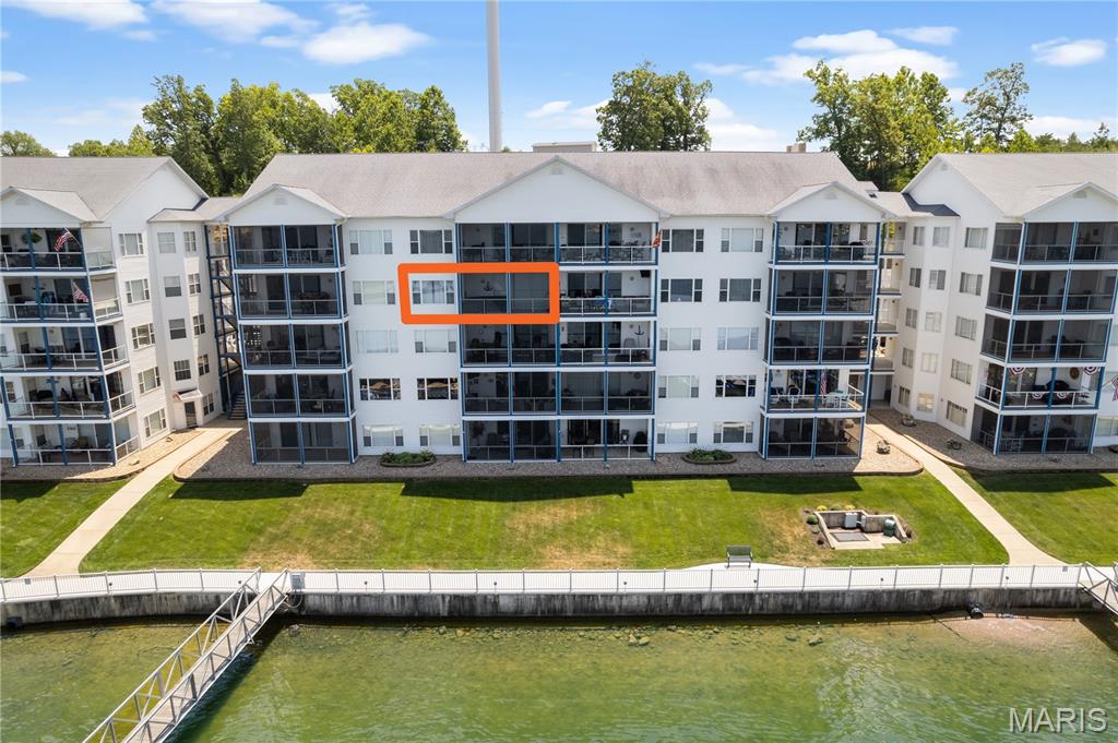 Luxurious! One word describes this TRULY AWESOME UPDATED unit's VIEW and Complex amenities! Located at the beginning of the Wonderful Gravois Arm at Lake of the Ozarks. Complex boasts 2 swimming pools (1 fresh, 1 saltwater) 2 dedicated swim platforms (1 with kayak launch), an exercise facility, fenced playground (with basketball & pickleball courts) and some of the best fishing at the lake will surely keep your family and guests entertained! Easy access, well lit docks. Unit includes a 12 x 32 boat slip! This complex is meticulously maintained and pet friendly! Elevator to the 4th level, amazing cabinetry, beautiful tile flooring, and a gentle slope to dock (No steps!). This Unit features a huge Tiled & Screened Deck! The boardwalk is great for evening strolls and enjoying the lake views! Friendly neighbors and events are just some of the reasons that make Blue Anchor Bay one of the most sought after condominium destinations at beautiful Lake of the Ozarks! Make your appointment to come experience this fabulous opportunity today! Unit has an Optional Garage w/large loft storage area for an additional $45,000.  Location: 4th floor, Interior Unit