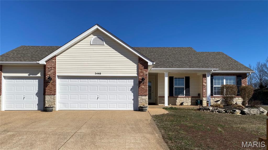 Price Reduction / Motivated Sellers**Former Display Home !!! This beautiful 3-bed, 2-bath, 3-car garage ranch home is needing a new owner ! With rock formation landscaping in the front yard to the flower and plant beds on the side and back yards, this home brightens up with gorgeous spring blossoms and beautiful plants the sellers were so proud of.  Entering the exposed aggregate driveway notice the abundance of off-street parking before entering the 3 car garage which has plenty of storage space. From the driveway to the covered aggregate front porch with sitting space, through the front door, the foyer of the home takes you to magnificent high vaulted ceilings in the great room. Straight forward notice the beautiful stone/brick gas fireplace that provides those warm cozy nights during the winters of the mid-west region. Gazing right see the hallway leading to the 2 secondary bedrooms and primary bedroom with private primary bath with adult height vanity, separate shower, and large tub. The primary also has a bay window bump out and a large walk-in closet. Looking left is the well designed spacious kitchen with crown capped original upgraded cabinets with newer glass backsplash, counter tops, and includes stainless steel appliances. Continuing to the laundry room and the 3-car garage you can't help but notice the ceramic tile floors throughout the kitchen, laundry, and dining room area in this open space with a center island with sink and dishwasher. On to the sliding patio door which leads you to the covered finished patio and spacious privacy fenced level back yard which has a garden area and a space where an above ground pool used to provide lots of summer fun. Level back yard has a double gate for easy access to enter with yard equipment. This home also has an interior entry to a large unfinished lower-level with room for expansion of more living space, possibly another bedroom with an egress window, and rough-in for a future full lower-level bathroom !! About a year ago the architectural shingle roof was replaced as well as the gutters, downspouts, and siding due to storm damage. This is a Must See Home at the beginning of the subdivision !! Sellers are providing a 1-year Ultimate Choice Home Warranty.