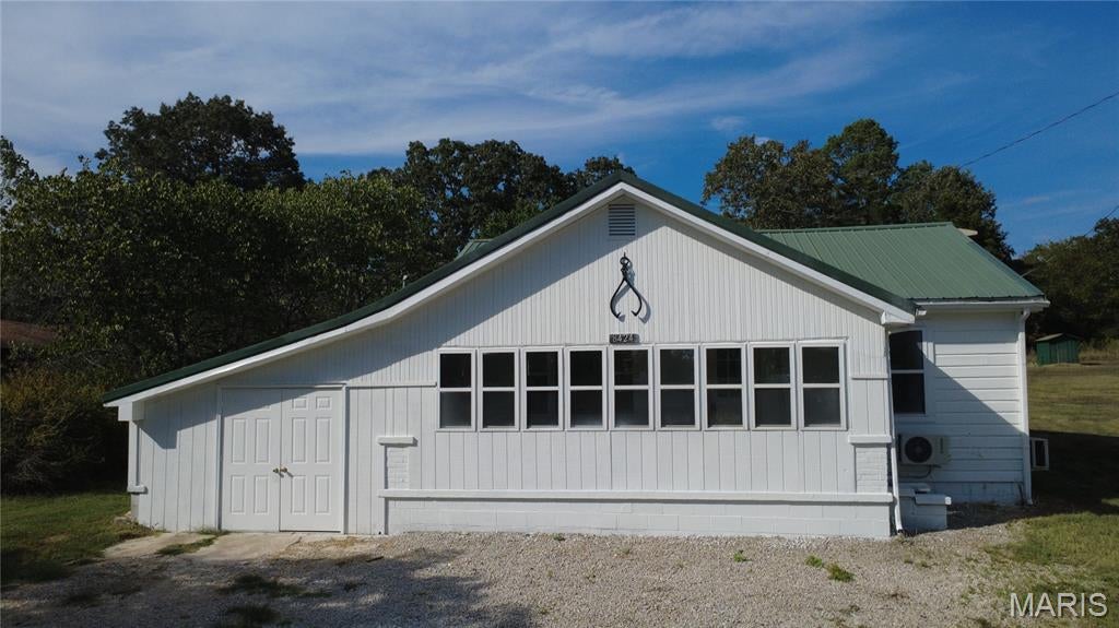 COUNTRY LIVING WITH NO HOA OR RESTRICTIONS! This charming 1957 country-style home offers approximately 980 sq. ft. of living space with 2 bedrooms and 1 bath and has been recently remodeled. Updates include fresh interior paint, new kitchen cabinets, luxury vinyl plank flooring, new stove and dishwasher, select new LED lighting, new water heater, and a new heating and air-conditioning system.
Situated on approximately 1 acre in the county, the property offers room to enjoy the outdoors with fencing on two sides. Relax on the 21' x 7' covered back porch or enjoy the 21' x 7' enclosed front sunroom.
A 12' x 20' attached workshop provides excellent space for hobbies, storage, or projects and could potentially be converted into a garage. The property also includes two large storage buildings and a well house.
If you're looking for an affordable country property with recent updates, usable outdoor space, plenty of storage, and no HOA or restrictions, this property is worth a look!