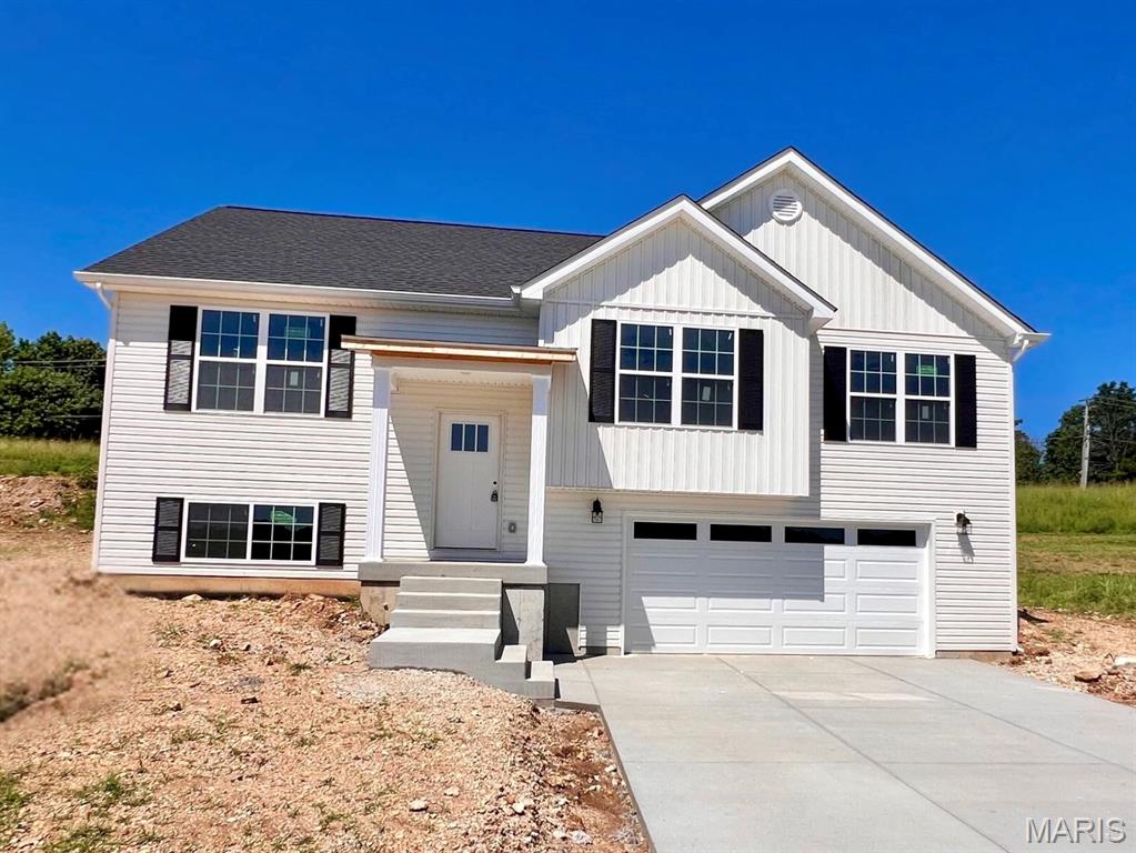 New construction home located in Alexandar Estates. This well-designed 3-bedroom, 2-bath residence offers a desirable split-foyer floor plan with main-floor laundry. The primary bedroom features a spacious ensuite bath, and the home is enhanced by a bay window providing additional natural light. Additional highlights include an attached 2-car garage and a convenient location in Washington, MO. A great opportunity to own a brand-new home in an established area. Estimated to be completed August 2026.
