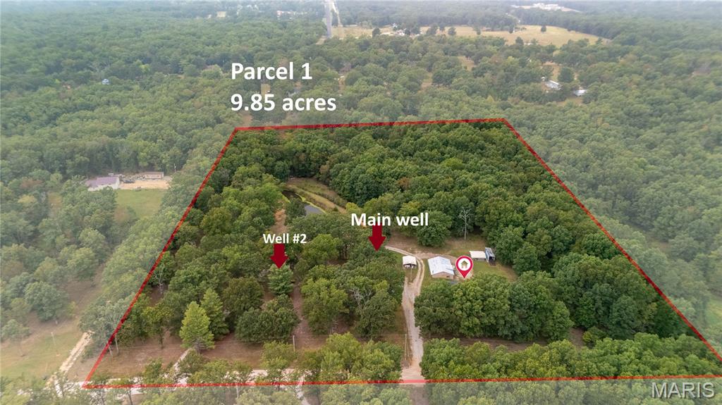 READY TO MOVE IN- Discover nearly 15 acres of possibilities just outside Salem city limits! This 2-parcel property features a two-bedroom, one-bath home, TWO WELLS, a stocked POND, and a (28'X40') WORKSHOP with concrete foundation wall, electricity and a wood-burning stove. Multiple storage buildings/CARPORT provide additional space for equipment and recreational gear. Live in the existing home while exploring the possibility of building your dream home, creating a family compound, establishing a hunting retreat, or simply enjoying the privacy and natural surroundings. Conveniently located near Montauk State Park, Flat Nasty, the Current River, and Mark Twain National Forest—and approximately 30 minutes from Rolla and Missouri University of Science and Technology—this unique property offers peaceful country living near some of the area’s best outdoor recreation and amenities. Can pass VA, USDA, FHA, Conventional loans!