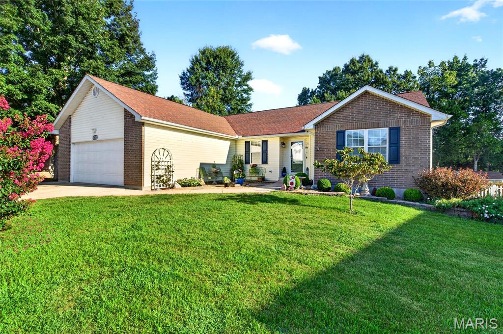 Well-Cared-For 3-Bed, 2-Bath Home in established neighborhood.  Attractive kitchen features abundant cabinet and counter space, pantry closet, and opens to roomy dining area. Just behind kitchen is a nice storage room that houses the natural gas furnace and water heater. The dining area features a newer sliding glass door that opens onto a large deck that overlooks fenced backyard, garden, & established trees. Living room features a vaulted ceiling, gas-log fireplace with Marble tile hearth, & wood-look laminate flooring. Spacious Primary Bedroom has renovated bathroom with low entry shower, pretty vanity, & large 6x8 m/l walk-in closet.  The lovingly maintained yard sets off the home with Dog Wood trees, Crepe Myrtle, Boxwood Bushes, lilies, hostas and more.   There are 3 storage sheds in the back yard, and it looks out over the Veterans Park creating a peaceful area to relax.  A generator hookup was installed in 2024 for peace of mind during emergencies. Come tour and see all this wonderful home has to offer.  Agents be sure to read Agent Remarks.