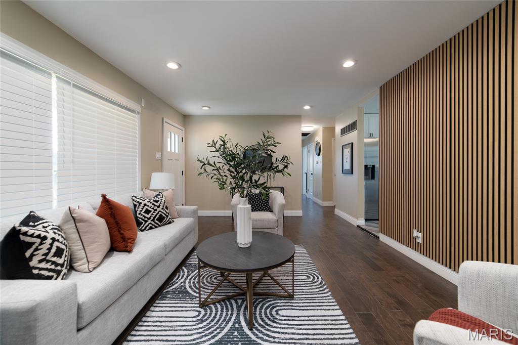 ***Welcome Home to 2405 Orleans!! (Hazelwood West Schools)****Just move in!****New Architectural Roof 4/2026***As you enter the living room there is a striking wall and a magnificent view to the right, with french doors, as you step down into your unique bonus sitting/family room, with large bay window, relax in front of your Beautiful Warm & Inviting fireplace, after a long tiring day, with soothing music! There is also space for a breakfast table*** Fabulous kitchen with 42' cabinets, granite countertop, breakfast bar and dual seating, also with a dining area ****All new Whirlpool appliances, ceramic tile flooring & carpeting thru-out. Bright, with lots of windows, new 2 panel doors thru-out. Relax in your hall bath soaking tub.  Custom designs through out. Crown molding & 5" baseboards. Fabulous New lights in place through-out! Ceiling fans w/lights in all bedrooms. Lower Level carpeted Rec Room with 9 can-lights..**** Part finished lower level***This home has so many nice features, to many to list...Must See! Beautiful new front door and striking curb appeal!**** Large Level Corner Lot***RV Parking Pad*** Convenient to stores, public transportation, parks, restaurants, downtown and Lambert Field Airport. "Don't let this one get away!****