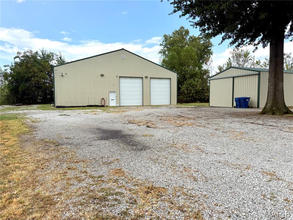 Barndominium & Massive Shop in Licking, Missouri – The Perfect Home Base for the Traveler!

Looking for a property that gives you the comforts of home while providing the space and versatility to support your love of travel, camping, hunting, fishing, and the outdoors? This unique barndominium in Licking, Missouri may be exactly what you’ve been looking for.

Located near Montauk State Park and other great outdoor opportunities like the Big Piney River and Mark Twain National Forrest this property offers approximately 1.2 acres and combines comfortable living space within an incredible 60’ x 60’ shop, making it an ideal home base for the traveler, outdoor enthusiast, hobbyist, or anyone needing serious storage and workspace.

The living quarters feature approximately 1,200 square feet with an open and functional layout. The kitchen/family room offers plenty of cabinetry and a large island with additional storage underneath. A bedroom/office provides flexibility for a bedroom, home office, or guest space, while the bath/laundry room includes a closet and walk-in shower. Above the living area is additional storage space, helping keep your living area organized or for future expansion of the living quarters.

Aside from the living quarters the remaining 40’ x 60’ heated and cooled shop side boasts two 12’ x 14’ overhead doors, two man doors, approximately 30’ of workbench space with upper and lower cabinets, 35’ of four-level pallet racking, and approximately 30’ of metal shelving, there is no shortage of room for vehicles, equipment, tools, large recreational toys, and everything else that comes with an active lifestyle.

The shop includes RV/camper hookups with water, clean-out, and a 50-amp breaker, allowing you to bring your RV home, keep it protected indoors, and have it ready for your next adventure. Imagine returning from a trip, pulling your RV inside, plugging in, unloading, and having everything ready for the next journey.

Additional features include a 60-gallon Iron Horse air compressor with 6.5 peak horsepower, 3-ton Goodman central heating and cooling and a indoor storm shelter.

Also on the property is an additional 23’ x 48’ building with dirt floor and a sliding door.  The building has electrical service and lighting throughout for plenty of room for additional storage or projects.

The property is ideally situated in Licking Missouri, putting you centrally located within easy reach of the beautiful Ozark outdoors, including fishing, floating, hiking, hunting, camping, and the clear waters of Montauk State Park and Big Piney River. Great location from Ft Leonard Wood, Rolla and Houston. 

Property Highlights:
-Barndominium-style living quarters
-60’ x 60’ heated/cooled shop with 1200 square foot of living area
-1200 square foot of storage area above the living quarters for future expansion.
-Two 12’ x 14’ overhead doors
-RV hookup with water, clean-out & 50-amp service
-Indoor RV/camper storage
-30’ workbench with upper/lower cabinets
-35’ of four-level pallet racking
-30’ metal shelving
-60-gallon Iron Horse air compressor
-Indoor storm shelter
-Additional 23’ x 48’ building with electric and lighting
-Convenient to Montauk State Park
-Excellent setup for travelers, outdoor enthusiasts, RV owners, hobbyists and small-business owners.

Whether you’re looking for a full-time residence, a weekend getaway, an RV home base, or a property where you can store all your toys and equipment under one roof, this one offers an uncommon combination of living space, shop space, storage, and location.

Come see why this isn’t just a home—it’s a home base for your next adventure.