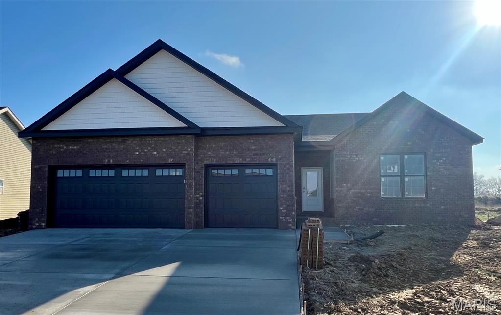 New construction home offering modern style and comfortable living throughout. The great room features a vaulted ceiling and an electric fireplace, creating a bright and inviting space. The kitchen includes quartz countertops, custom cabinetry, and a convenient butler’s pantry, with main-floor laundry just steps away. The primary bedroom offers a walk-in closet and a bathroom with a dual-vanity sink. Two additional bedrooms and a full bath complete the main level. A full unfinished basement provides excellent potential for future expansion or storage. Enjoy a private backyard and the convenience of a 3-car garage. Located close to schools and Scott AFB. Buyer to verify all information.