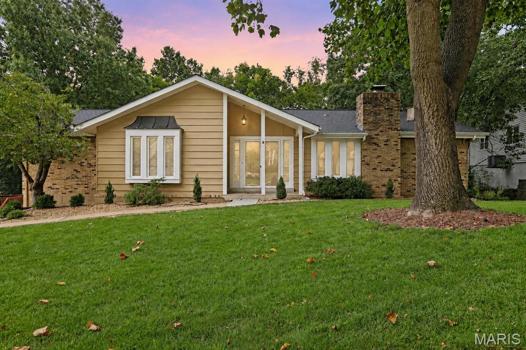 **Open House Canceled, Home is now UNDER CONTRACT**Welcome to this inviting ranch in the heart of Chesterfield, offering a spacious layout, beautiful updates, and plenty of room to enjoy both inside and out! As you step inside, you’ll immediately notice the abundance of natural light and gleaming hardwood floors that flow throughout the main level. Make your way into the open living room, where vaulted ceilings create a bright and airy feel. The living room flows seamlessly into the updated kitchen featuring white cabinetry, new quartz countertops, stainless steel appliances, ample prep space, and breakfast bar seating—perfect for casual meals or gathering with family and friends. Just off the kitchen, the separate dining room features a cozy fireplace and provides a welcoming space for hosting dinners, holidays, and entertaining.

Down the hall, you’ll find the spacious primary ensuite complete with double closets, a generous vanity, and a separate tub and shower. Two additional generously sized bedrooms offer plenty of flexibility for family, guests, or a home office, while a full hall bath with a shower/tub combo completes the main level.

The finished walkout lower level provides even more living space with a spacious recreation room perfect for movie nights, a game room, playroom, or additional entertaining space. You’ll also find a versatile bonus room and an additional full bath featuring an updated vanity, flooring, and walk-in shower. A dedicated laundry and storage area provides plenty of space to keep everything organized. The 2-car garage offers additional storage and workspace for added convenience.

Step outside and discover a backyard that feels like your own private retreat. The back deck overlooks the spacious, level yard surrounded by mature trees, providing plenty of privacy and room to relax, play, or entertain. A separate patio area is ideal for gathering around a fire pit, while the covered space beneath the deck provides another great spot to enjoy the outdoors. The home also features a new roof, installed in 2025. Conveniently located in Chesterfield near an abundance of shopping, dining, entertainment, and easy highway access, this home offers the perfect combination of space, comfort, and location.