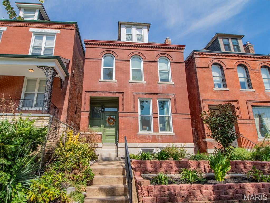 Charming historic 2.5-story home in Forest Park Southeast, just a short walk from all kinds of fun in The Grove. Whether you’re grabbing a smoothie or Sunday brunch at Hello Juice, settling in for date night at Vicia, or meeting friends for happy hour at HandleBar, you’ll have plenty to do right outside your door. And with enviable interstate access, getting to BJC, Forest Park, or pretty much anywhere else in St. Louis is a breeze (you might even stop being late). :)

Inside, the main level has an easy, open flow with a comfortable living room featuring a fireplace, a dining room, and a kitchen that opens toward the back of the home. But the real showstopper? The screened-in porch. You, your houseplants, your morning coffee, and a good book may never want to leave. IMO, it’s the best room in the house.

Upstairs, the primary suite offers a separate shower and soaking tub—the perfect place to unwind after a long day. Two additional bedrooms, a second full bath, and laundry round out this level.

And there’s still more upstairs! The third floor features a huge family room that could be your movie-night headquarters, home office, workout space, or guest hangout. Step outside onto the sunbathing platform up there and soak up some vitamin D while you’re at it (and hey, no tan lines if that’s your thing--we don't judge).

There’s so much character and charm packed in here. It’s the kind of house that reminds you why old homes are worth loving. Prepare to fall in love! 

Want more info? Skip the Zillow rabbithole & reach out to me, the listing agent, directly for more info or to schedule a tour.