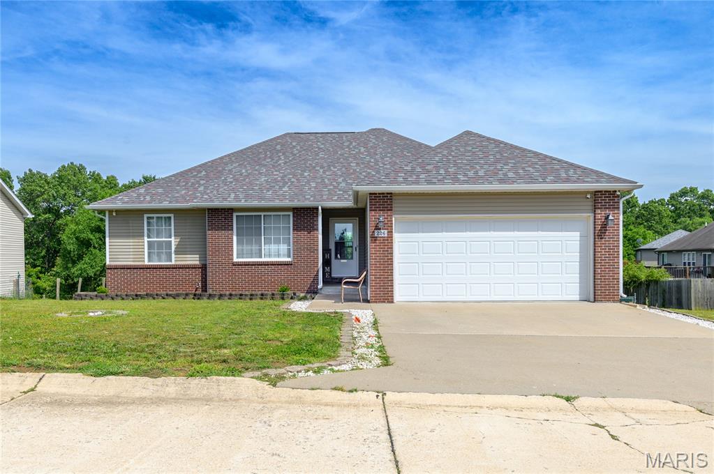 Welcome home to this beautifully maintained 3-bedroom, 2-bath residence located in the desirable Pioneer Ridge subdivision. Featuring the new updated roof August 2025, sliding glass door, common space's new paint and new flooring. This home offers an inviting open floor plan with vaulted ceilings, abundant natural light, and comfortable living areas designed for everyday living and entertaining. The spacious kitchen boasts custom cabinetry, ample counter space, and stainless steel appliances, flowing seamlessly into the dining and living areas. The primary suite features a walk-in closet, dual vanity, jetted tub, and separate shower. Two additional bedrooms and a full bath provide flexibility for family, guests, or a home office. Situated on a generous 0.56-acre lot, the outdoor space includes a deck overlooking the wooded and fenced backyard—perfect for relaxing, entertaining, or enjoying the peaceful setting. Additional highlights include a huge storage downstairs, two-car attached garage, mature landscaping, and a convenient location just minutes from Fort Leonard Wood, schools, shopping, and dining. Don't miss this opportunity to own a move-in-ready home in one of Waynesville's sought-after neighborhoods.