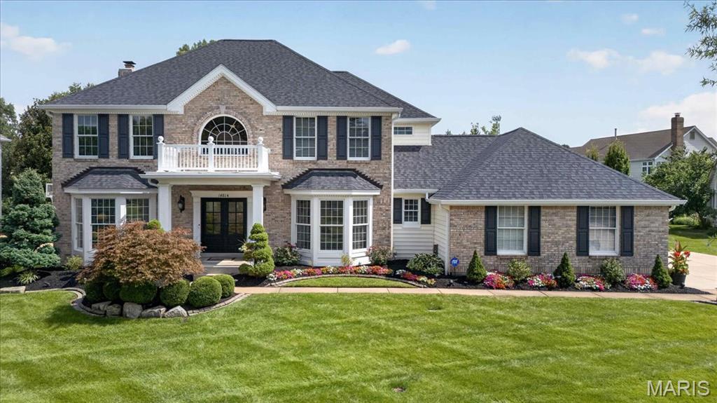 Welcome to 14814 Straub Hill Lane, a beautifully maintained two-story home situated on a spacious .42-acre lot in desirable Brook Hill Estates in the heart of Chesterfield. Offering over 4,200 square feet of living space, this impressive 4-bedroom, 3.5-bath residence combines timeless traditional style with generous living and entertaining spaces throughout. Step inside to a dramatic two-story entrance foyer that sets the tone for the home’s bright and inviting interior. Hardwood flooring, high ceilings, recessed lighting, built-in features and an open, flowing floor plan create a wonderful setting for both everyday living and entertaining. A separate dining room provides an elegant space for gatherings, while the spacious family room is anchored by a wood-burning fireplace and custom built-in bookcases. The kitchen serves as the heart of the home, featuring abundant white cabinetry, dark countertops, a large center island with seating, electric cooktop, wall oven, microwave and dishwasher. The adjoining breakfast area is surrounded by natural light and offers direct access to the outdoor living space, creating an effortless flow between the kitchen, dining and family room areas. Upstairs, you'll find all four bedrooms, including a spacious primary suite with a tray ceiling, walk-in closet and an expansive private bath. The primary bath offers dual vanities, extensive cabinetry and a large separate shower. Three additional bedrooms and another full bath complete the upper level. The partially finished lower level adds approximately 1,000 square feet of additional living space and offers incredible versatility. Enjoy a large recreation area, built-in cabinetry and workspace, wet bar, additional sleeping area and a full bathroom—ideal for entertaining, overnight guests, a home office, fitness space or game room. Outdoor living is equally impressive. The expansive paver patio provides multiple areas for dining, lounging and entertaining, complete with a built-in barbecue and fire pit. Mature landscaping, established trees and a large, level lawn create a beautiful backyard setting with plenty of room to enjoy the outdoors. A three-car attached garage adds even more convenience and storage. Located within the Parkway School District and served by Claymont Elementary, West Middle and Parkway West High School, this exceptional Chesterfield property offers abundant space, a functional floor plan and impressive indoor and outdoor entertaining areas—all in an established neighborhood setting.