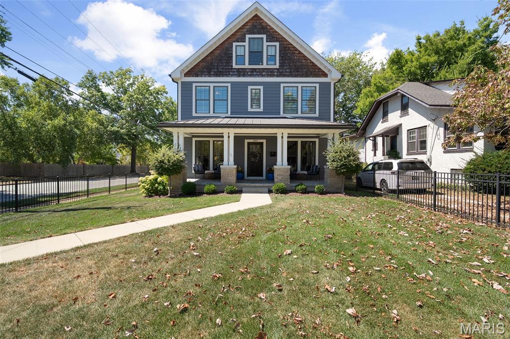 Craving a more urban lifestyle or a great condo alternative in the heart of literally everything downtown Kirkwood has to offer?  Look no further as this home is the epitome of a the casual, walkable Kirkwood lifestyle so many buyers crave.  The fully fenced yard including both front and side yards is perfect for kids/pets! Walk to Kirkwood Park, hear the music from the patio of your favorite restaurant, and ditch your car for a golf cart, or better yet, your feet!  The home has nearly 4000 square feet of living space on four levels as well as a nice sized deck tucked between the house and garage. The main level includes a luxury kitchen and breakfast room opening to a wonderful great room. There's also both a casual living and dining room up front.  Both are perfect for entertaining that flows onto the picturesque covered front porch.  A second level features a large master suite, a laundry room, and two additional bedsrooms sharing a hall bath. On the third floor is a fabulous loft with commanding views of Kirkwood as well as a 4th bed and bath. Finally, the lower level is almost completely finished with a huge rec room, daylight windows, and a potential 5th bedroom (just missing doors) or a great workout room or office. This home truly offers everything your heart desires in a walkable and easy maintenance location.  It's a pretty rare scenario for downtown Kirkwood!  Get ready to be wowed and be sure to check out the video link!