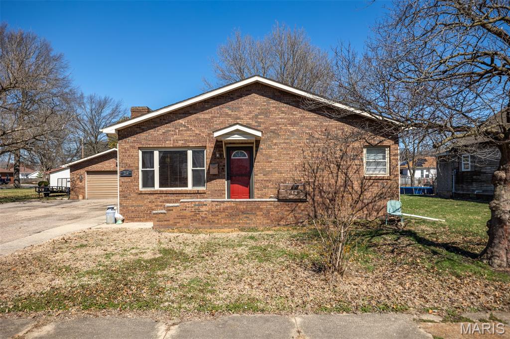 Don’t miss this well-maintained 2-bedroom, 1-bath all-brick home offering comfort, durability, and plenty of outdoor appeal. Inside, you’ll find a warm and inviting living space featuring a wood-burning fireplace, perfect for cozy nights at home. Step outside to enjoy the screened-in back patio, ideal for relaxing or entertaining without the worry of bugs. The fenced-in backyard provides privacy and space for pets, kids, or gardening.This property also includes an extra lot, offering additional room to expand, build, or simply enjoy the added space.A 2-car detached garage provides ample storage and parking. With its solid brick construction and desirable features, this home is perfect for a variety of buyers—schedule your showing today!