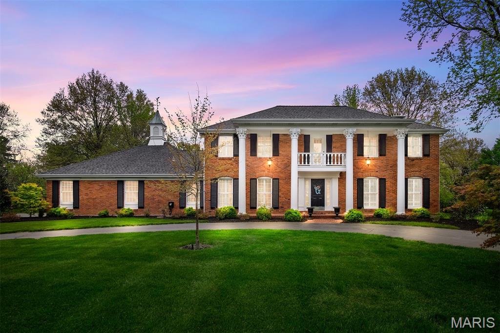 Stately two-story in Town and Country, located on sought after private lane off Topping Road has been recently updated with an open floor plan, high-end finishes, custom millwork, hardwood floors and plantation shutters.  This park-like 1+ acre level lot, designed by a MO Botanical Garden horticulturist, is stunning both day and night. This outdoor oasis can be admired from a new covered patio equipped with a full outdoor kitchen that adjoins a paver-patio with fire pit and exterior lighting. The renovated kitchen includes cathedral ceiling, custom cabinetry, Wolf Range with hood, Subzero Fridge, ice maker & wine fridge. Spa-like primary bath with separate shower & multiple rain heads, river rock, heated floors & pedestal tub.  Main floor mudroom/laundry is complete with built-in lockers and half bath. Finished lower level features an additional bed, bath, fireplace, family room, rec area, gym, and wet bar. A bonus room above the garage makes for a great man cave/activities room.
