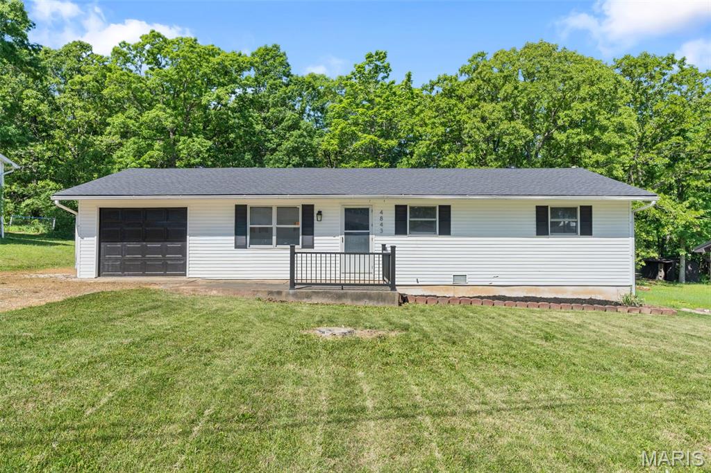 Welcome to 4843 Woodland Drive in Sullivan! This newly renovated, turn-key home is completely move-in ready and packed with updates throughout. Featuring 3 bedrooms and 1 beautifully updated bathroom, this home has been freshly painted and includes new trim, roof, appliances, flooring, lighting, plus a fully remodeled kitchen and bathroom.Inside, you’ll find three spacious bedrooms and a large bathroom highlighted by an oversized walk-in shower complete with handicap-accessible accessories for added comfort and convenience.

Situated on approximately one-third of an acre, the property offers plenty of room for kids, pets, and outdoor entertaining. The level lot also includes a detached one-car garage and a lean-to with ample space for tools, equipment, or recreational toys.  Enjoy the peaceful country setting while still being just minutes from Sullivan and Bourbon for shopping, dining, and everyday conveniences. This is the perfect blend of quiet country living and easy access to town amenities!