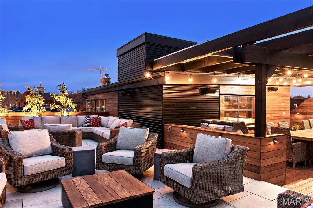 Discover this iconic mixed-use opportunity in the heart of the Central West End—where refined residential living meets limitless commercial potential. Spanning four levels and accessible by both elevator and staircase, this architecturally striking property offers a seamless blend of sophistication and versatility.

A dramatic entry foyer introduces a gallery, boutique or restaurant space anchored by a private courtyard, complemented by a fitness studio and attached garage. 

Beginning on the second floor, the penthouse residence is truly magazine-worthy, featuring an expansive great room, a commercial chef’s kitchen, breakfast room, wine cellar, bar, formal dining, and two bedrooms—including a serene primary suite with spa-inspired bath.  Outdoor living is elevated with a private lap pool/spa and curated lounge spaces. The third level offers ultimate flexibility with a guest suite, office, or entertainment venue—complete with kitchenette and overhead door access to the outdoor pergola lounge, serving areas and private patios.

The finished lower level adds depth and character with stone walls, a spacious recreation room, kitchenette, two additional bedroom suites, a spa room, laundry, and abundant storage.

Equally suited as a private luxury residence, boutique hospitality concept, private club, or creative commercial venture—this is a rare Central West End offering designed for those who live, host, and create at the highest level.