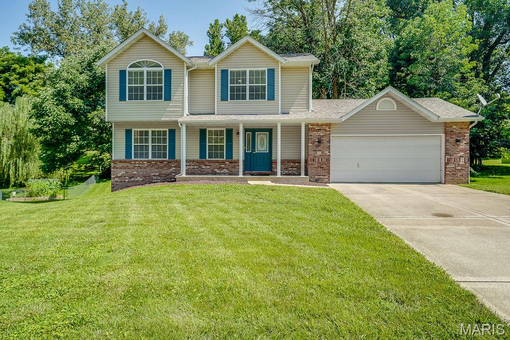 Welcome to this beautifully updated 2-story home nestled on a quiet cul-de-sac in Glen Carbon! Situated on a spacious .30-acre lot in an established neighborhood, this home offers both comfort and convenience in the sought-after Edwardsville School District as well as access to the Interstate, shopping and schools.

Step inside to find fresh paint and brand-new carpeting throughout, along with stylish updates in the kitchen and bathrooms that make this home truly move-in ready. The main level flows seamlessly to the outdoor living spaces, featuring a deck just off the kitchen—perfect for entertaining or enjoying your morning coffee.

Upstairs, you’ll find three comfortable bedrooms, while the finished walk-out basement adds additional living space and opens to a patio, ideal for relaxing or hosting guests. A covered front porch adds charm and curb appeal, creating the perfect spot to unwind at the end of the day.

With its desirable location, modern updates, and inviting layout, this home is a must-see!