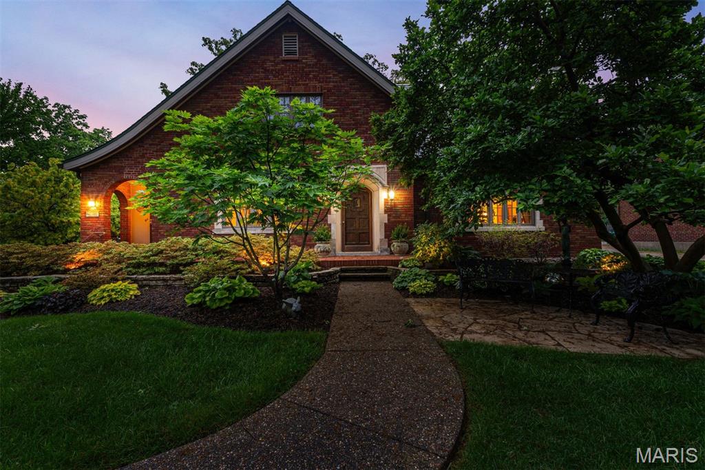 A once-in-a-lifetime opportunity to own the defining home of the neighborhood—the one admired by all who pass, where architecture, gardens, and timeless charm come together as living art. This is that rare, shining star.
Masterfully conceived and crafted over a century ago, this residence reflects an era when every detail was executed to the highest Euro-American standards. Lovingly stewarded for decades, the current owner has thoughtfully enhanced the home with a sun-drenched solarium, beautifully remodeled baths, and numerous significant upgrades—while preserving its original character.
The grounds are nothing short of extraordinary. Created by a master gardener, they have evolved into Sherwood Forest’s own botanical sanctuary, celebrated with countless accolades and awards. Every path, planting, and vista is curated to inspire.
Inside, the home reveals a collection of irreplaceable architectural treasures. A breathtaking barrel-vaulted great room anchored by a stunning fireplace. An expansive dining room awash in natural light. A heated conservatory that offers year-round serenity. Together, they create a true retreat for both entertaining and everyday living.
A main-floor bedroom and full bath provide flexibility for guests, aging in place, or convenient single-level living. The charming gallery connecting the secondary entry and kitchen invites relaxed moments—perfect for morning coffee or evening cocktails. The well-designed kitchen offers an ideal work triangle, abundant storage, and picturesque garden views.
Upstairs, three spacious bedrooms await, including an oversized primary with generous closets, a bright and cheerful secondary room, and a truly unforgettable showpiece: an authentic Pullman train car replica, commissioned by the original Missouri Pacific Railroad executive owner—a conversation piece unlike anything else.
Additional highlights include a substantial lower level for storage and an attached garage.
Homes of this caliber, provenance, and distinction rarely come to market. This is more than a residence—it’s a legacy.  
Hold on! There's more! Don't miss the enchanting free standing Gardener's Tea Room/getaway/at home office!