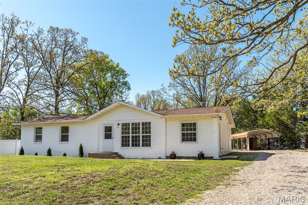 PRICE DECREASE!! Welcome home to rural quiet life at 2640 Hwy H.! This ranch home is a completely renovated country gem with over 1600 sq. ft. The living room boasts a new built-in electric fireplace with mantle and almost a full walls length of windows. Continuing on to the fully renovated kitchen you will find custom butcher block countertops, gorgeous custom cabinetry and stainless steel appliances, the perfect recipe for the chef in your family.  All stainless steel appliances in kitchen stay with the home, refrigerator, dishwasher, oven, and microwave. Kitchen holds a separate dinette area so you are closer for seconds! The laundry room has new washer and dryer that stay with the home as well! The master bedroom shines with new floors, large double closet and  beautifully renovated master bathroom. There are 2 additional bedrooms and a freshly remodeled full primary bathroom There is a large bonus room with a counter and mini-fridge, with its own private exterior entry/exit that could be an additional family room, den, guest room, office or home gym!  New outside central air unit installed 04/2026, majority of plumbing lines replaced, and the entire home has new luxury vinyl plank flooring throughout. Motivates Seller is providing a 1 yr home warranty. The backyard provides privacy and awaits your garden design! Home is 5 miles outside of town, close enough for easy shopping trips, but still enjoying the country sunsets and stars.