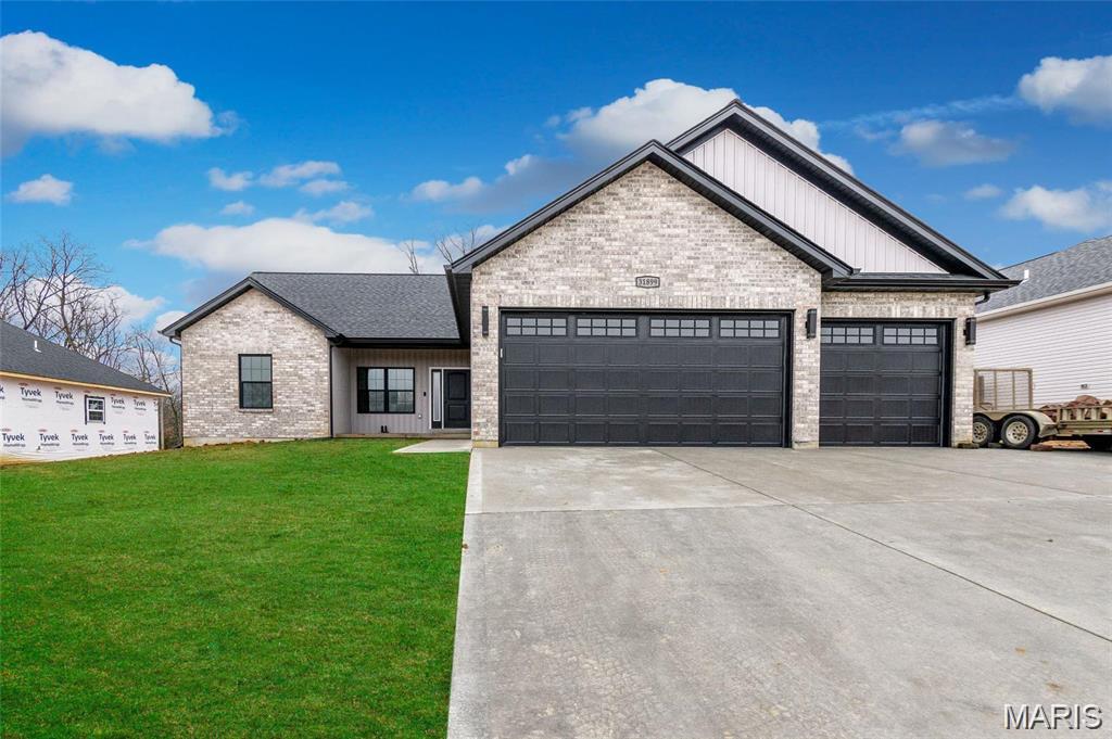 The Blake model is a 1,634 sq ft ranch with a divided bedroom floor plan and 3 car garage. When you walk through the front door you will notice the spacious family room with ceiling fan which is open to the chef's kitchen with an oversize island and granite counter tops. There are two spacious bedrooms both with ceiling fans and a bathroom just off the family room. The massive owner's suite features a large walk in closet, ceiling fan, and bathroom with a double bowl vanity, separate shower with glass shower door, and tub. There is a main floor laundry and a separate mud room. You will notice can lights throughout and all appliance packages come with a refrigerator. Downstairs you will notice a full rough in for your future expansion and a walkout with a sliding glass door and two windows, if the lot allows. Front and side yards will be sodded. All homes come with a 1 yr builder warranty and 2-10 year warranty for yrs 2-4. Come by and pick your lot and make your home your own!