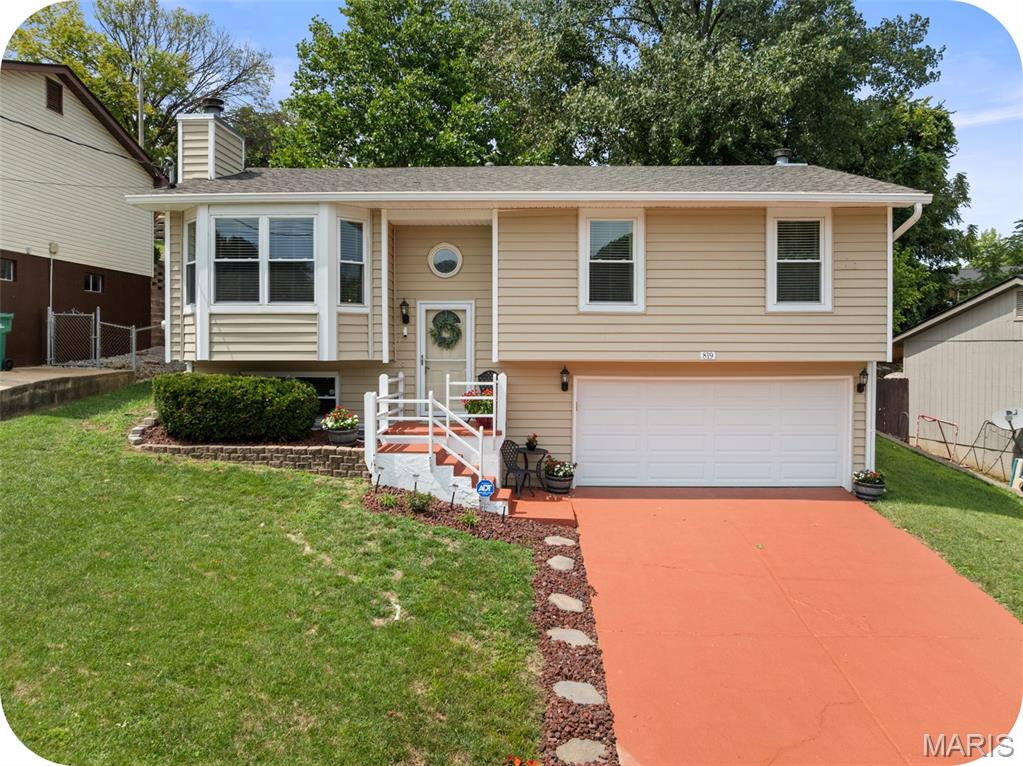 Take advantage of this wonderful opportunity to own a beautiful home in the desirable Windsor School District! This inviting 3-bedroom, 2.5-bath home offers comfortable living spaces, thoughtful updates, and a relaxing backyard retreat. Beautiful laminate flooring runs throughout the main level, while the cozy living room features a fireplace and flows seamlessly into the dining area. Tons of natural light coming from the window and skylight. The updated kitchen offers granite countertops, newer stainless steel appliances, plenty of cabinet space, and everything you need for everyday living and entertaining. The spacious primary suite is a true retreat with its own private fireplace and updated full bath. Two additional bedrooms with great closet space and another full bath complete the main level. Head downstairs to the finished lower level, where you'll find a wonderful family room with plenty of space to relax, entertain, or create a home office or play area. Lower level also includes a laundry room and half bath. Step outside and you'll be wowed by the beautiful patio, spacious fenced backyard, and pretty landscaping—an ideal setting for summer gatherings, pets, or simply enjoying some time outdoors. Additional highlights include a 2-car garage and a well-maintained exterior. Conveniently located near schools, shopping, dining, and major highways. This home offers the perfect blend of comfort, space, and convenience. Don't miss your chance to make this wonderful home your own! Bonus features include: Newer roof, HVAC, Water heater, kitchen appliances, flooring, and much more.