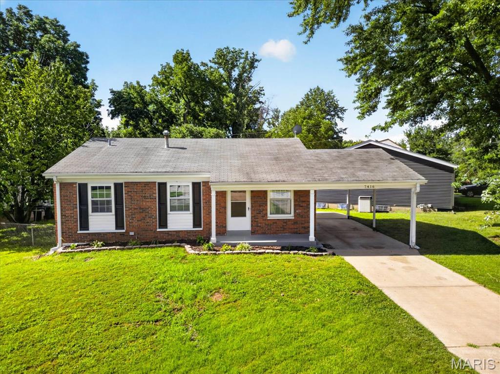 Ready to move in updated home. It has a great floor plan and sits on a large  corner lot with fenced in back yard. Freshly painted, with wood floors and new bath surround on main level  . Enjoy thanksgiving in the dining room with family.  The lower level has new bath, large laundry room, and extra storage room. You will like the large family room in the lower level also.