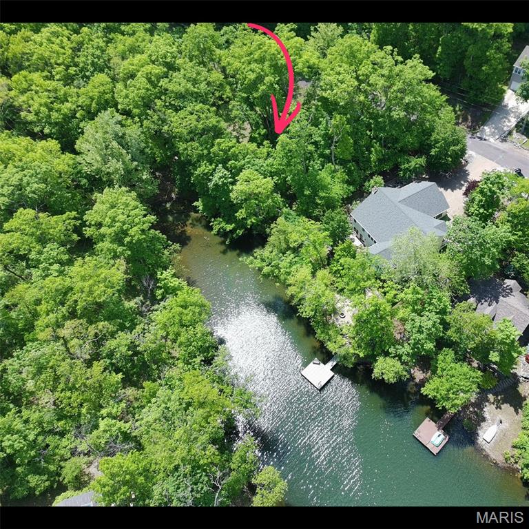 Discover the perfect place to enjoy lake living in the highly sought-after, 24-hour gated community of Lake Sherwood! This beautiful 0.26-acre waterfront lot offers approximately 90 feet of shoreline and over 100 feet of road frontage, providing the ideal setting for your dream getaway. Water and sewer hookups are available at the road, and while this is an exceptional building site, there is no requirement to build, giving you the flexibility to enjoy the property now and build when you're ready.
Tucked away in a peaceful cove, you'll enjoy quiet waterfront living while still having a front-row seat to the community's spectacular fireworks display. Conveniently located just 2 miles from the front gate, it's also only a short boat ride to the Community Center, Lakeside Grill and Club Pool where you can pull up by boat and grab a burger or two before spending the rest of the day on the water.
 Enjoy the year-round lake with six stocked lakes ranging from 3 to 130 acres, with the main lake allowing gas-powered motors! The community also features a clubhouse, pool, campground, sandy beach, marina, and much more. Located in the Washington School District, it's minutes from downtown Marthasville and close to the charming towns of Augusta and Washington. Whether you're looking to build your forever home, a weekend retreat, or invest in one of the lake's premier waterfront locations, this property offers endless possibilities.
Start making memories on the lake today!