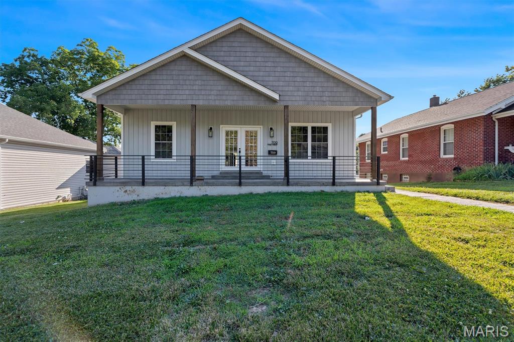 Welcome home to this beautifully maintained, less-than-5-year-old executive-style residence offering modern finishes, thoughtful design, and true move-in ready comfort. From the moment you arrive, the oversized covered front porch with stamped concrete and steel railing sets the tone—perfect for relaxing and enjoying the outdoors.

Step inside through French doors to an open-concept living space highlighted by sleek lines, vaulted ceilings, and rich hardwood flooring throughout. The heart of the home is the expansive kitchen, featuring a large island with leathered granite countertops, ample seating, soft-close cabinetry, and a walk-in pantry designed for both function and entertaining.

The split-bedroom floor plan provides privacy and flexibility. The spacious primary suite features a coffered ceiling, a luxurious en-suite bath with double vanity, soaking tub, walk-in shower, and professionally finished closets. The secondary bedrooms are generously sized and separated by a full bath, offering comfort for family or guests.

Main floor conveniences include an oversized laundry room. The lower level extends the living space with 9-foot ceilings, an egress window, a large family room or office area, and a half bath—ideal for work, play, or entertaining.

Outdoor living continues with an 8x34 composite covered deck, perfect for morning coffee or evening gatherings. The heated oversized 2-car garage and expanded concrete driveway provide ample parking, with additional space for an RV or boat.

A rare opportunity to own a modern, well-appointed home that combines style, space, and functionality in a truly turnkey setting.