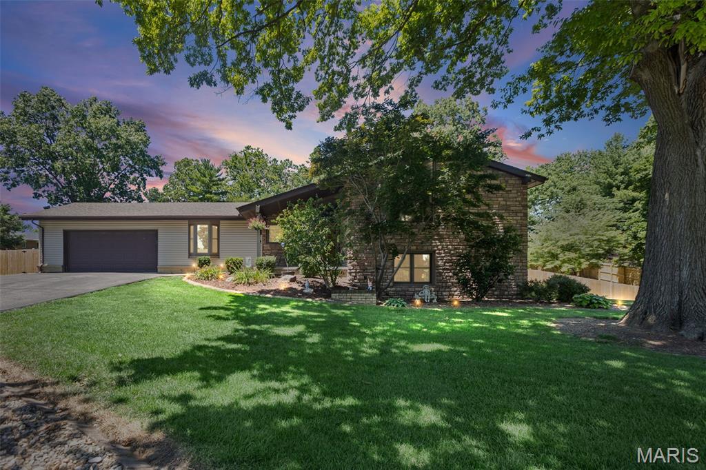 A Hidden Gem!!!  Must See, this unique multi-level home with so much to offer.  Possible 5 bedrooms, 3 bathrooms.  A wonderful open kitchen with updates galore.  Center island, and all appliances to stay.  Gas fireplace in the great room adds ambiance to any gathering.  The upper level includes a wonderful primary bedroom and bath, large walk in closet, the home office is well lit and includes a great sitting room.  Lower level has 4 bedrooms, and additional full bath.   The basement includes another family room and utility room with laundry .  Two hot water heaters to accommodate the newer Geo-Thermal HVAC system installed in 2025.  Very large deck in 2024 just off the dining area.  Very large back yard with completely enclosed privacy and above ground pool.  Storage shed for pool equipment.  New roof to be in place prior to closing.  Well cared for and ready for a new family.  Roxana School District.