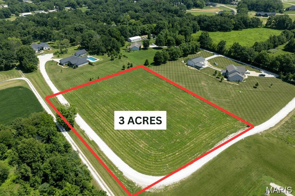 Rare find off Highway 79: three flat, buildable acres on a quiet cul-de-sac in St. Paul, addressed O'Fallon, in the Fort Zumwalt School District. The ground is wide open and level front to back — no grading headaches, no timber to clear, and an obvious build envelope the moment you walk it. Minimal restrictions mean no mandated builder, no architectural review board, and no clock forcing you to break ground. Bring your own plans, builder, and timeline. Three acres leaves room for an outbuilding, shop, garden, or a deep buffer from the neighbors, on an established street with substantial custom homes nearby. FEMA Zone X (unshaded), minimal flood risk. Minutes to Highway K, Bryan Road retail, I-70, and Hwy 40/61. Buyer to verify utilities, well/septic, soil and perc testing, zoning, and setbacks with St. Charles County; acreage and boundaries approximate. Survey has been attached.